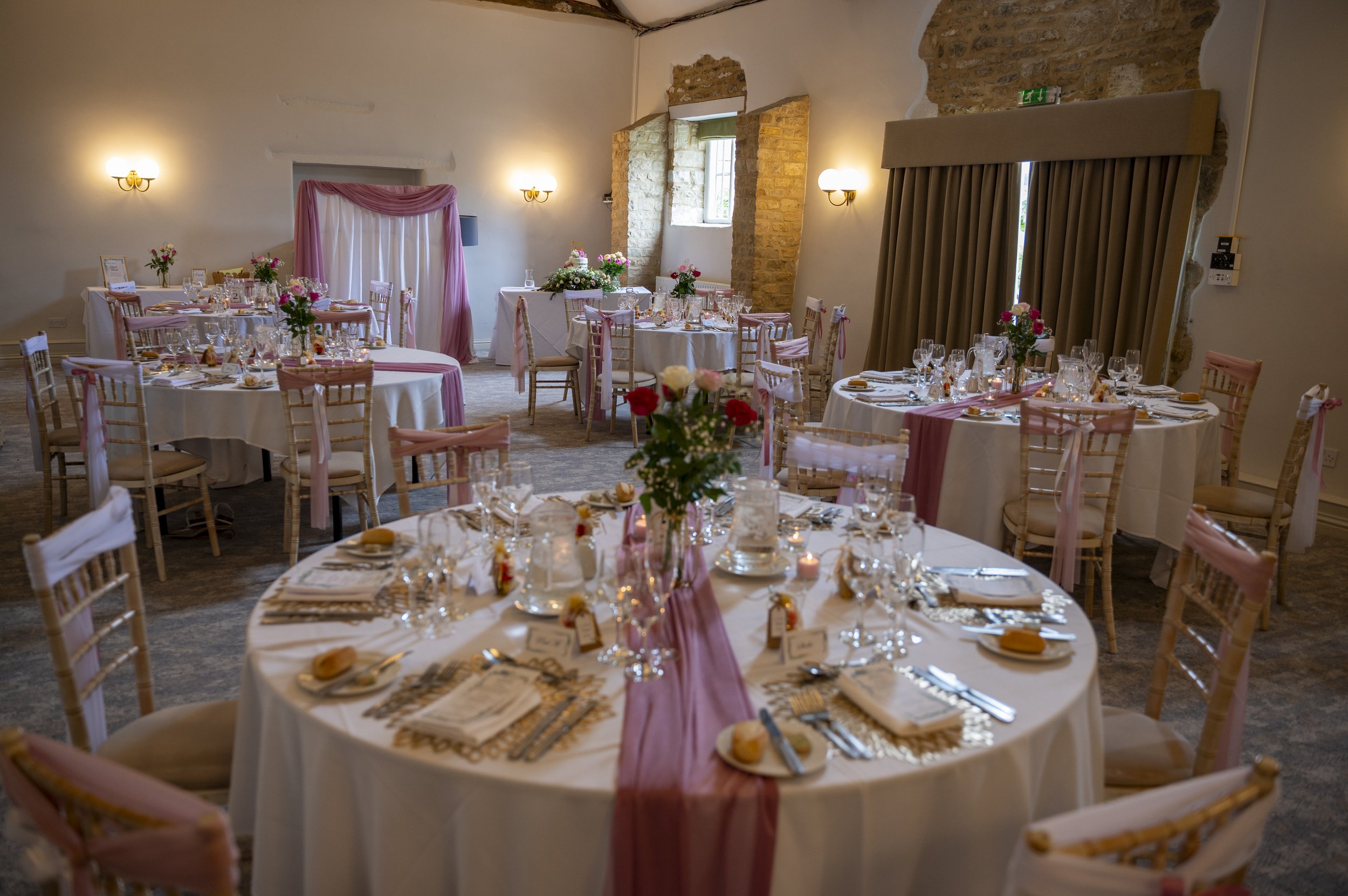 Fully finished and prepared wedding breakfast tables awaiting guests at Voco Spires