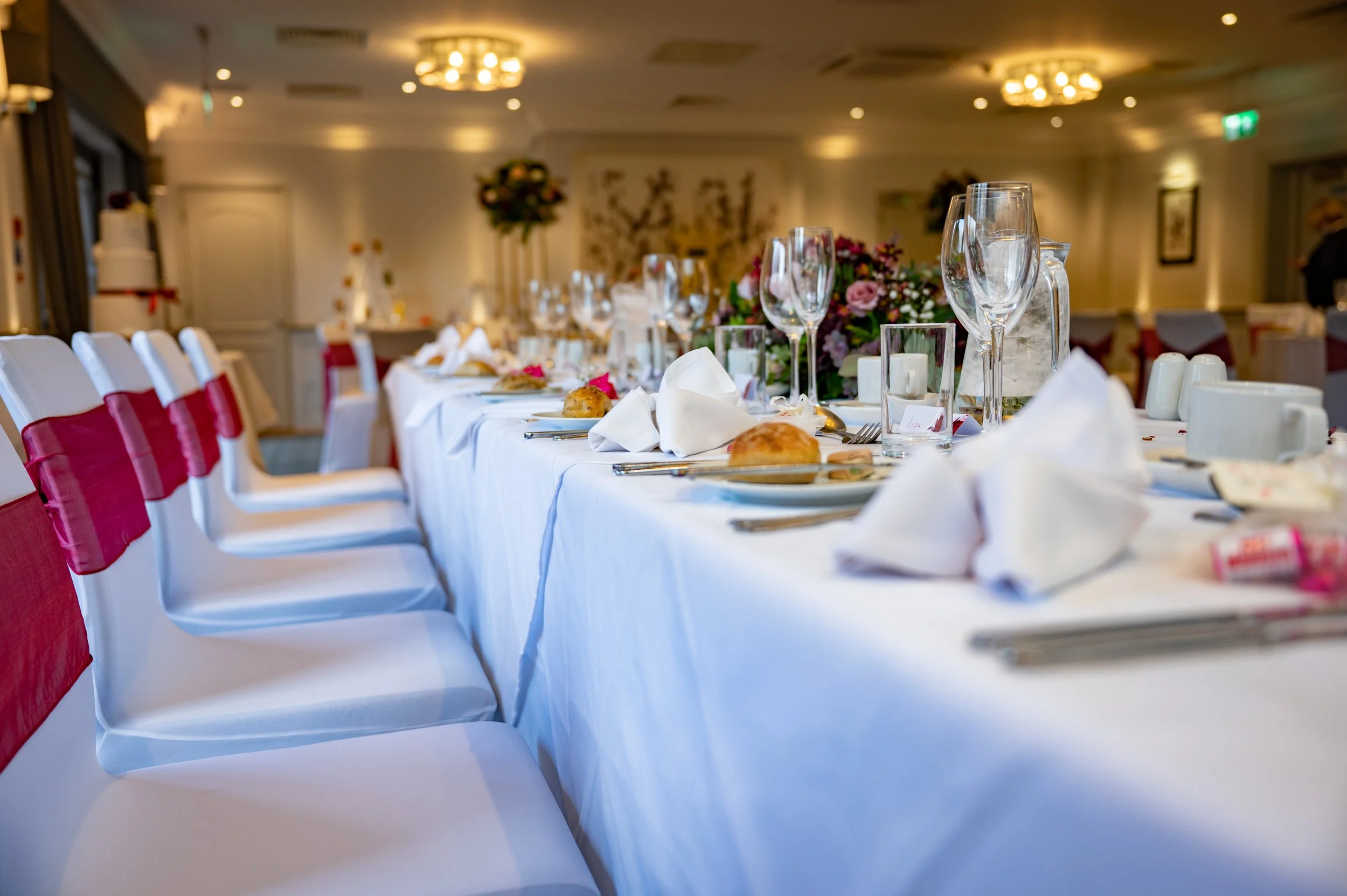 a close up of a wedding breakfast table all set up in readiness for guests
