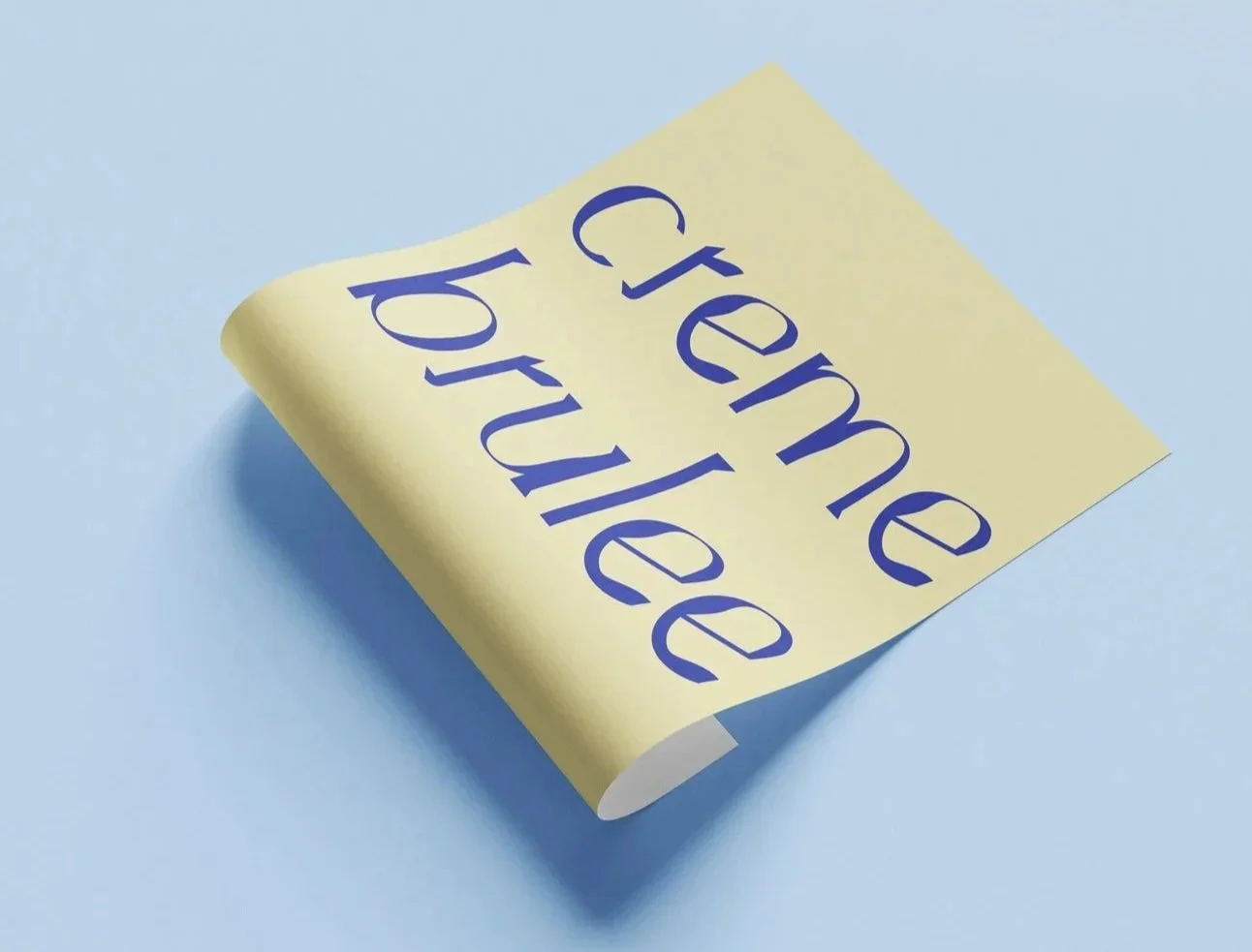 A yellow sticky note with the words 'create feedback' written in blue text, partially curled on a light blue background.