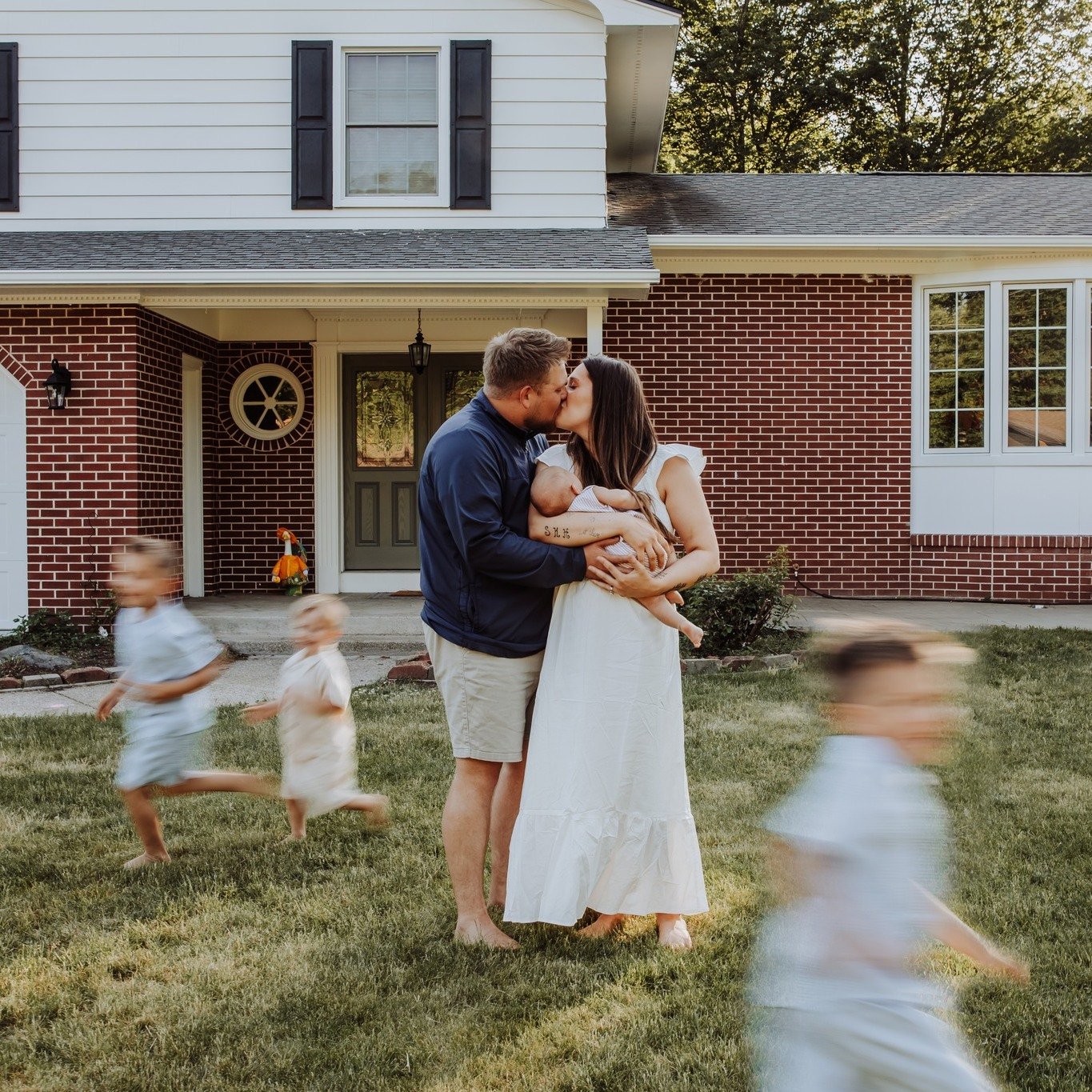 One day this house will look different.
The boys will be bigger.
The front yard will be a little quieter.

But these photos will always bring them back to this season...the one filled with bare feet, endless laps around the front yard, baby snuggles,