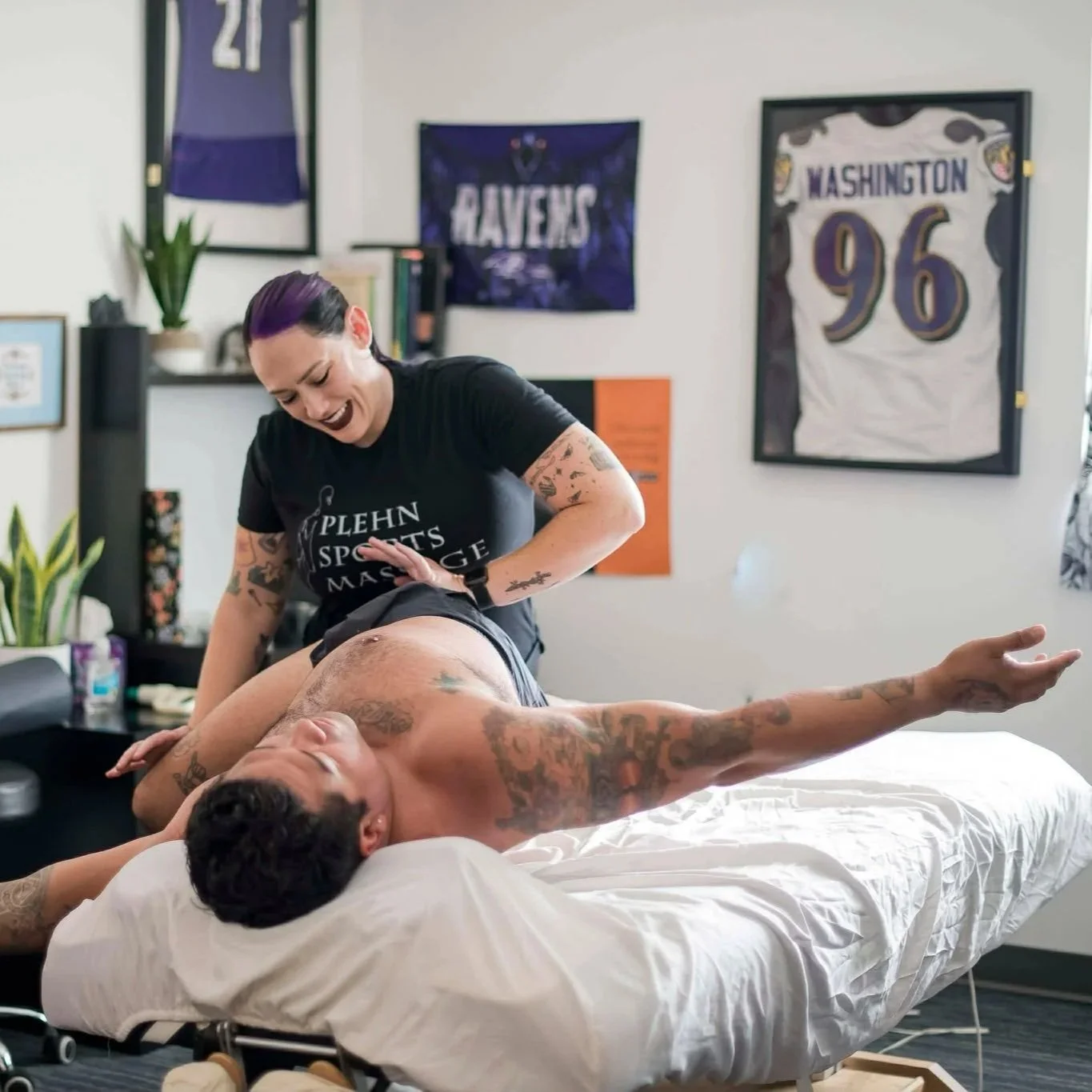 Caty treating an Olympic Weightlifter and Runner