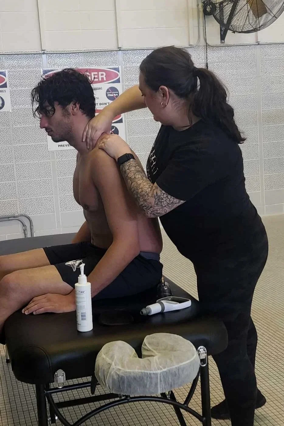 Chelsea at JHU treating a swimmer