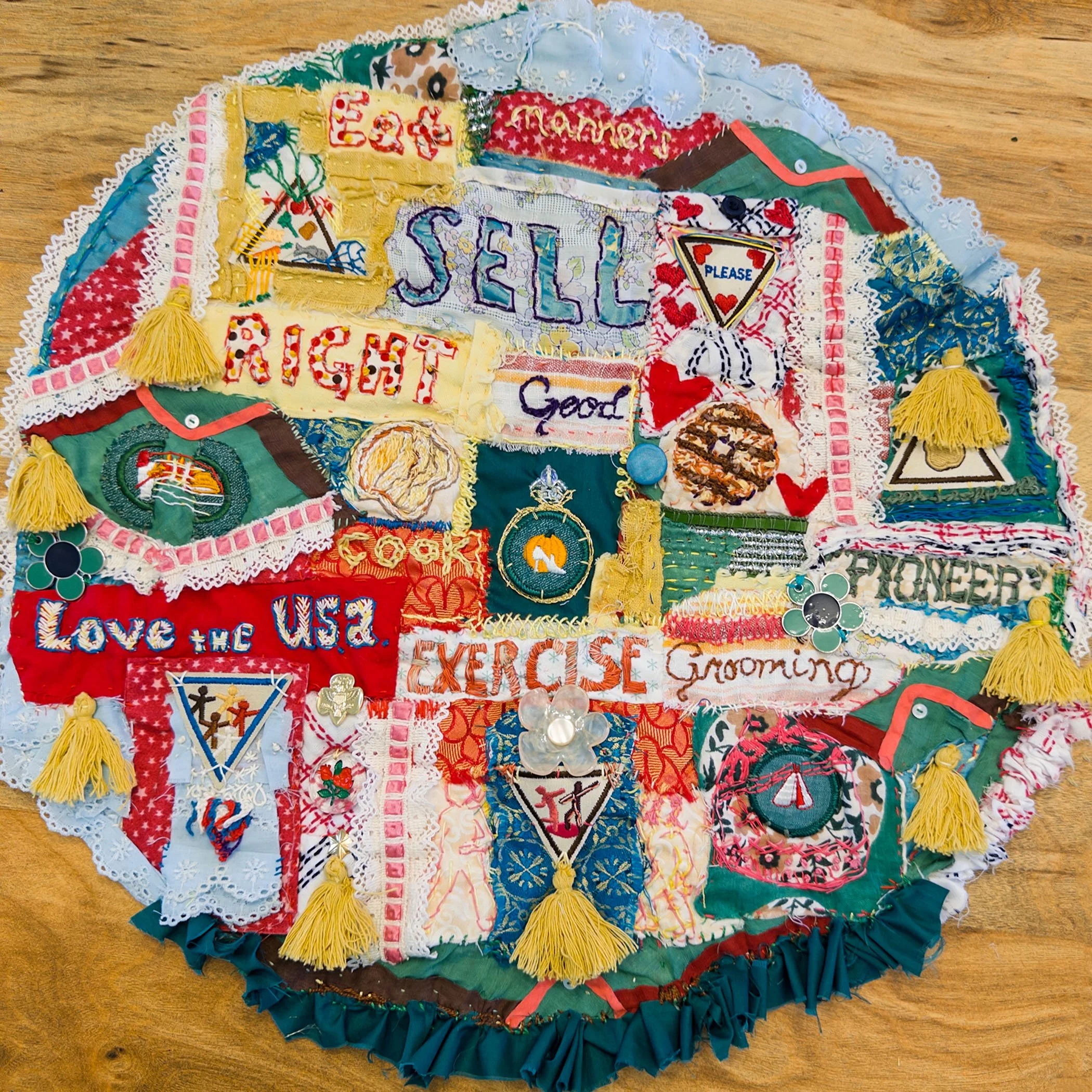 “Respect Authority” - 18 inches diameter. Vintage Girl Scout badges, vintage and reclaimed fabric, fibers and jewelry components.