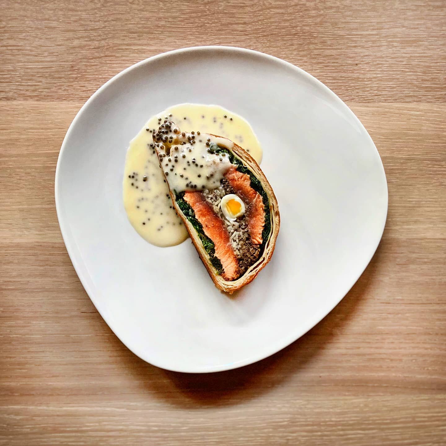 Classics never get old. Salmon Coulibiac, Mushroom Duxelle, Basmati Rice, Quail Egg, Champagne Beurre Fondue with @kaviari_paris Golden Oscetra Caviar. Inspiration is depicted from my recent trip to the Northwest region. Salmon from @skunabay is a de