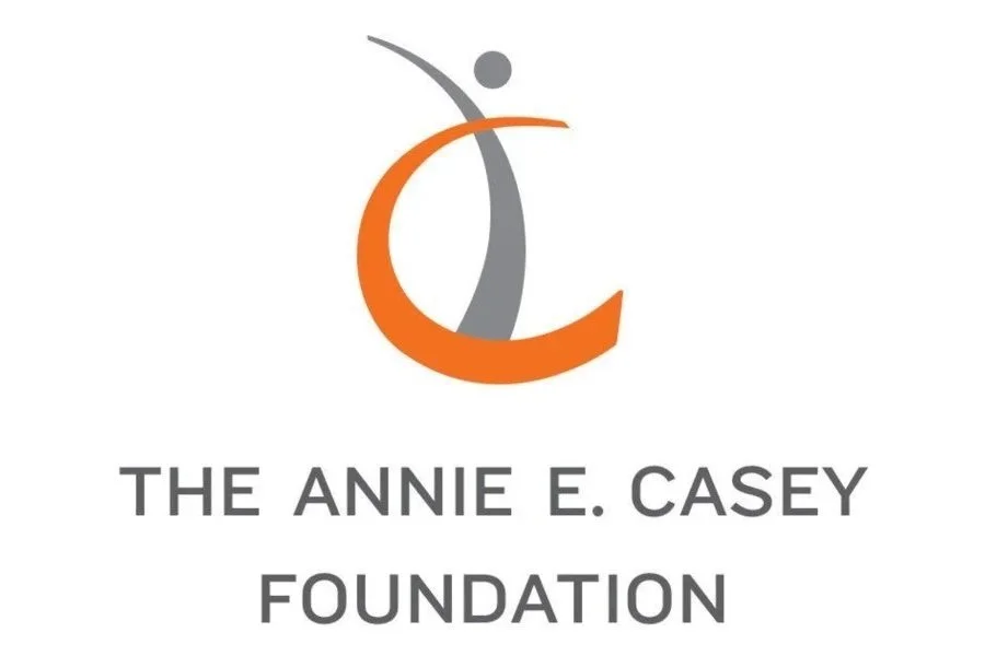 Logo of The Annie E. Casey Foundation with an abstract design of a stylized human figure in gray and orange, and the foundation's name below.