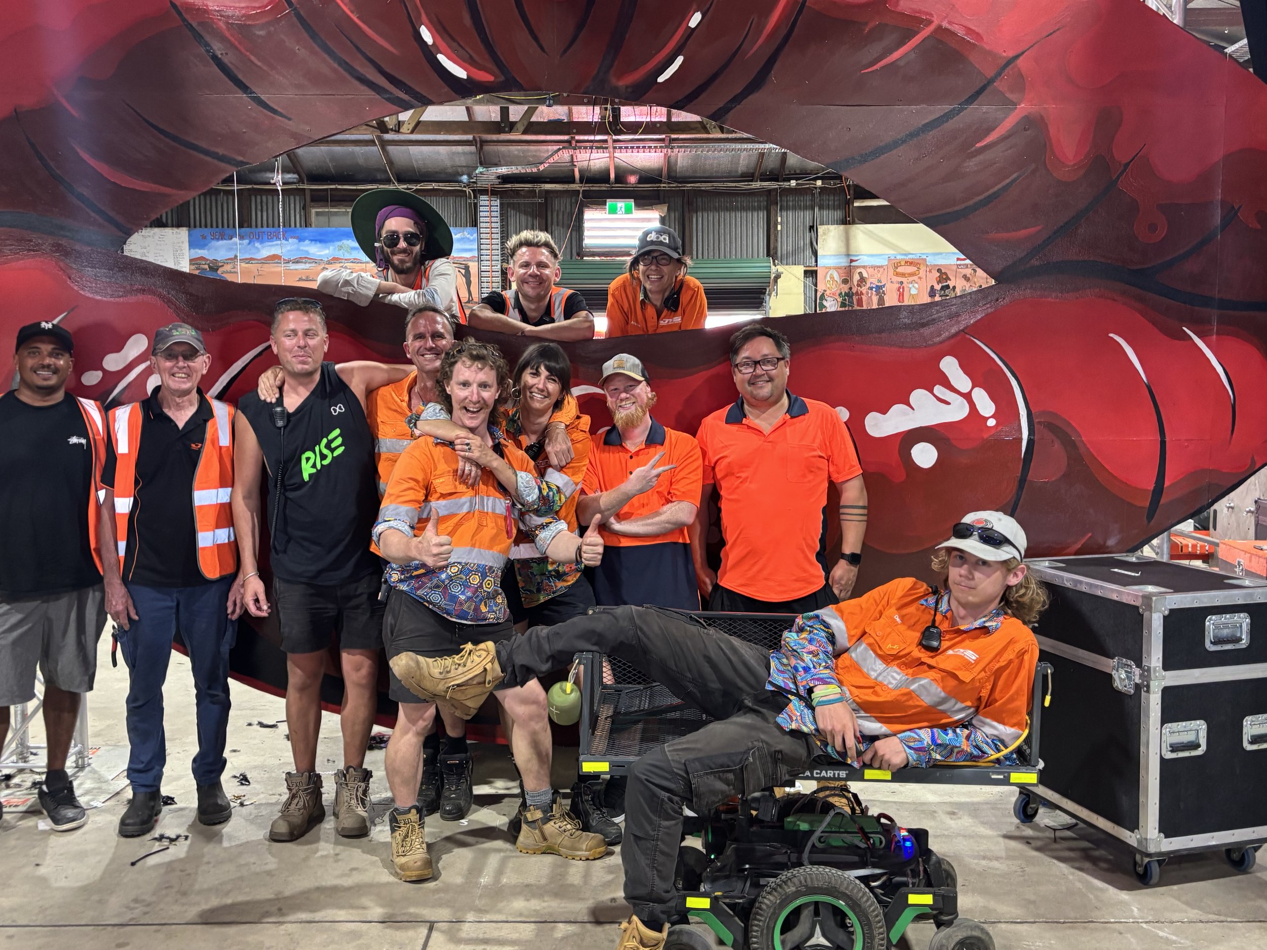 Group photo of the JTS Production team @ Tropical Fruits, standing in front of a installed DJ stage