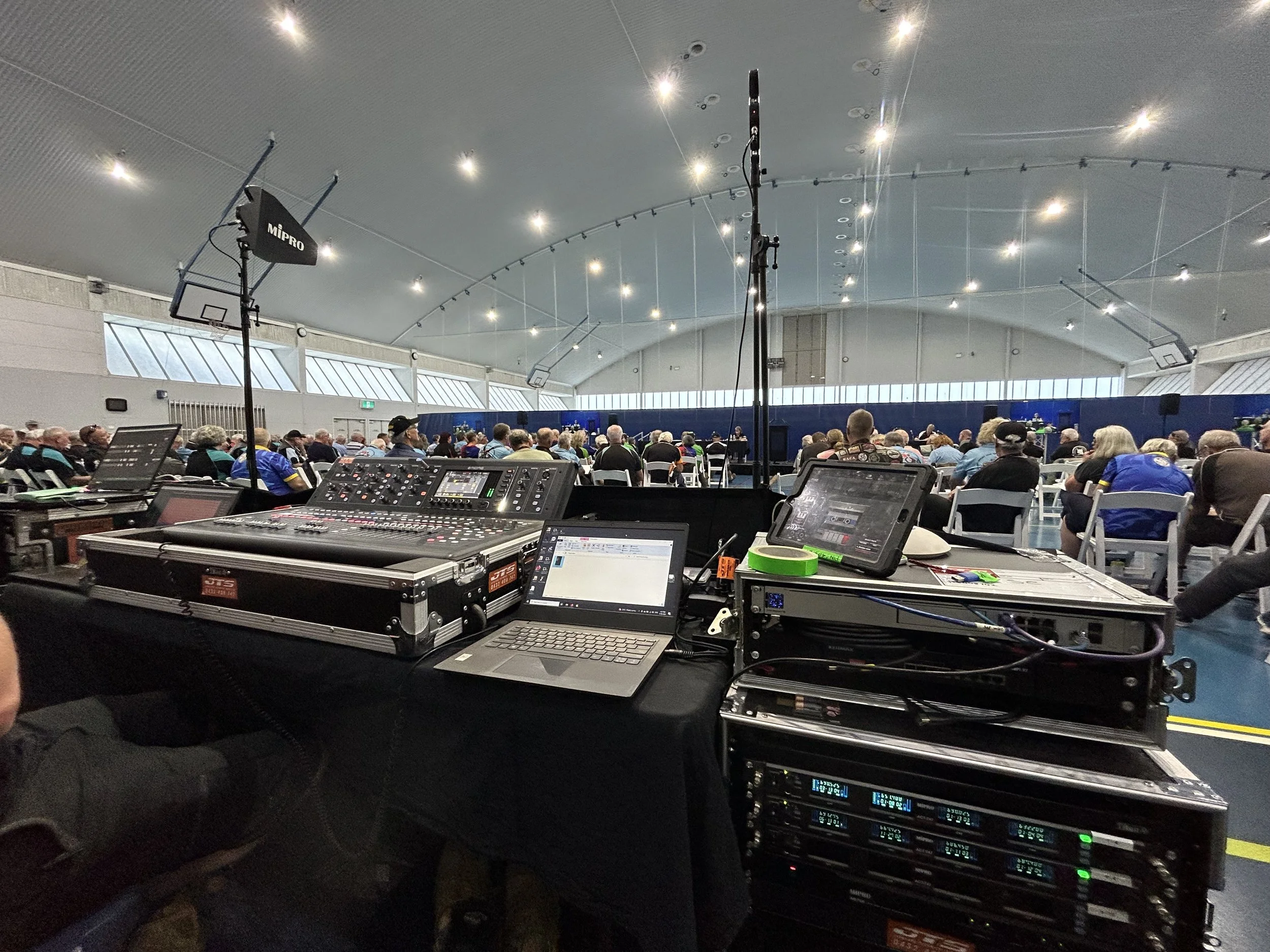 picture of a corporate event set up, with a mixing desk and lights 