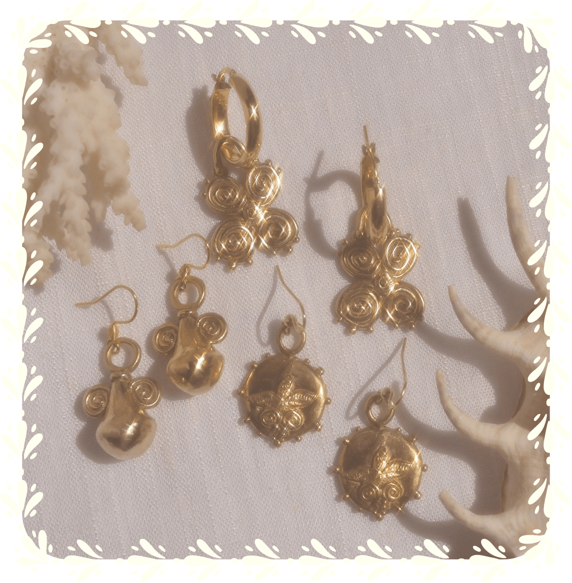 hand-crafted bronze earrings and charms in vase, butterfly and palm pendants.