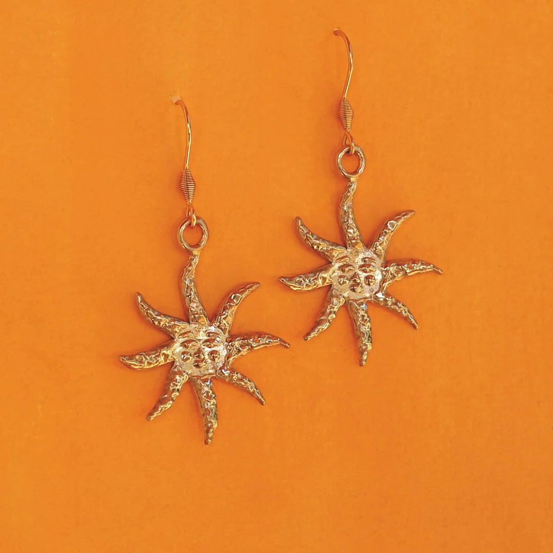 Sun earrings in bronze jewellery.jpg