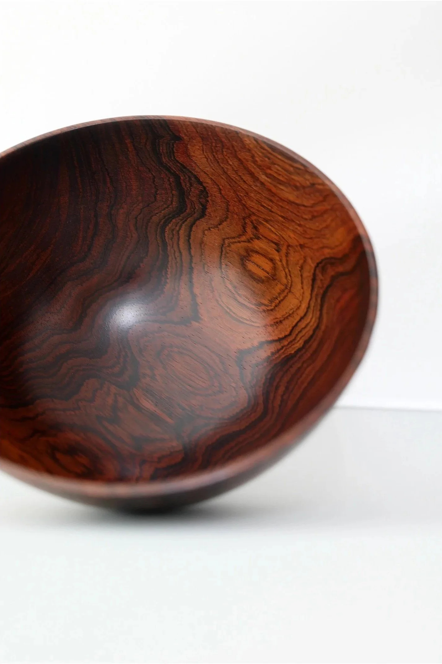 Hand-turned exotic Rosewood hardwood bowl by Bob Stocksdale with dramatic grain and sculptural organic form