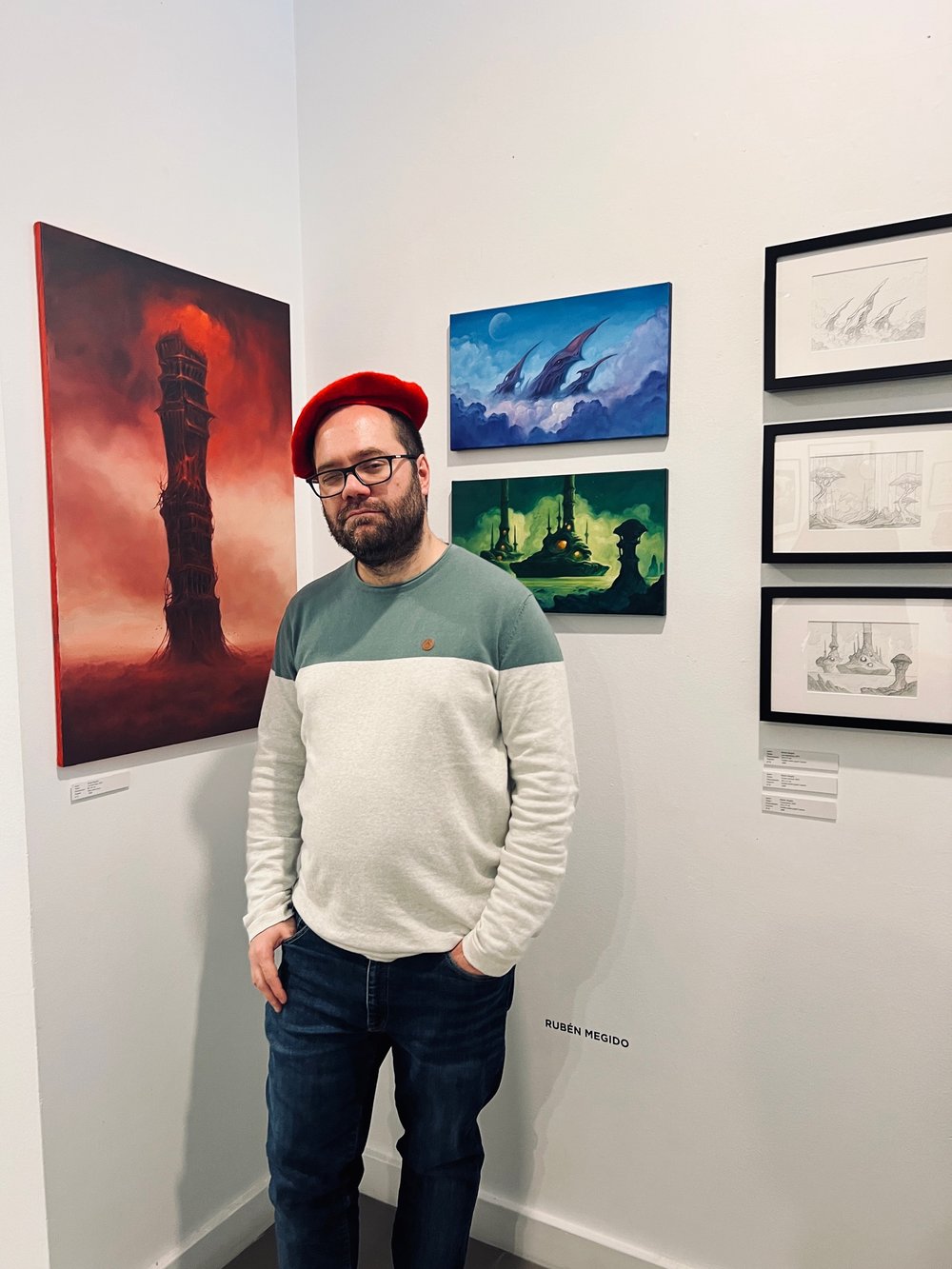 Ruben Megido posing in front of his work