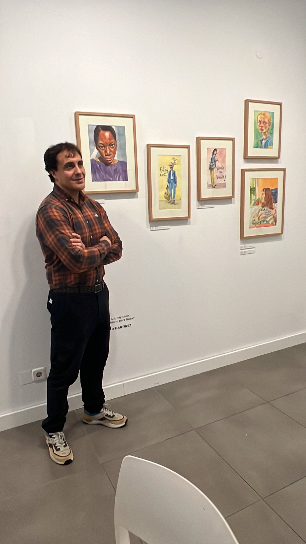 Bruno Martinez posing in front of his work