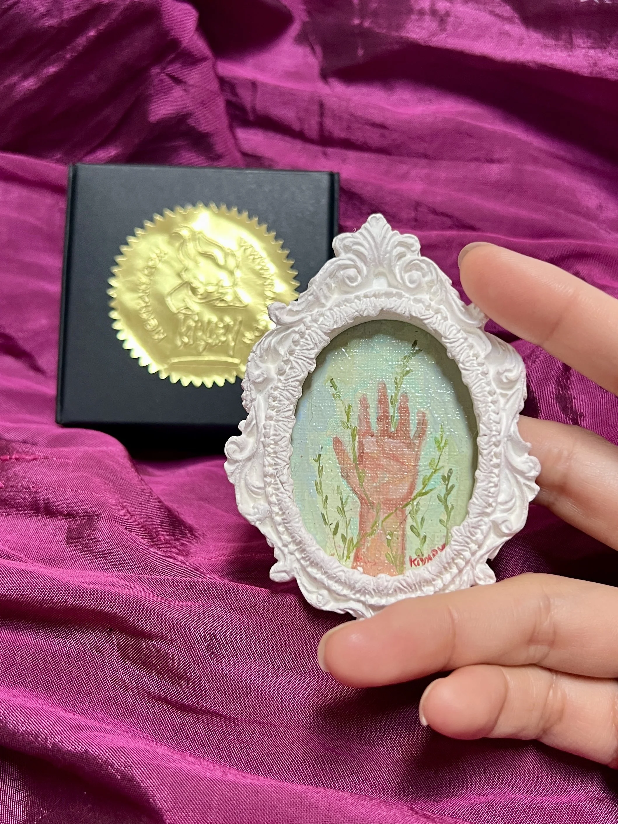 Miniature Oil painting Hands with nature hands holding kiyary.JPG