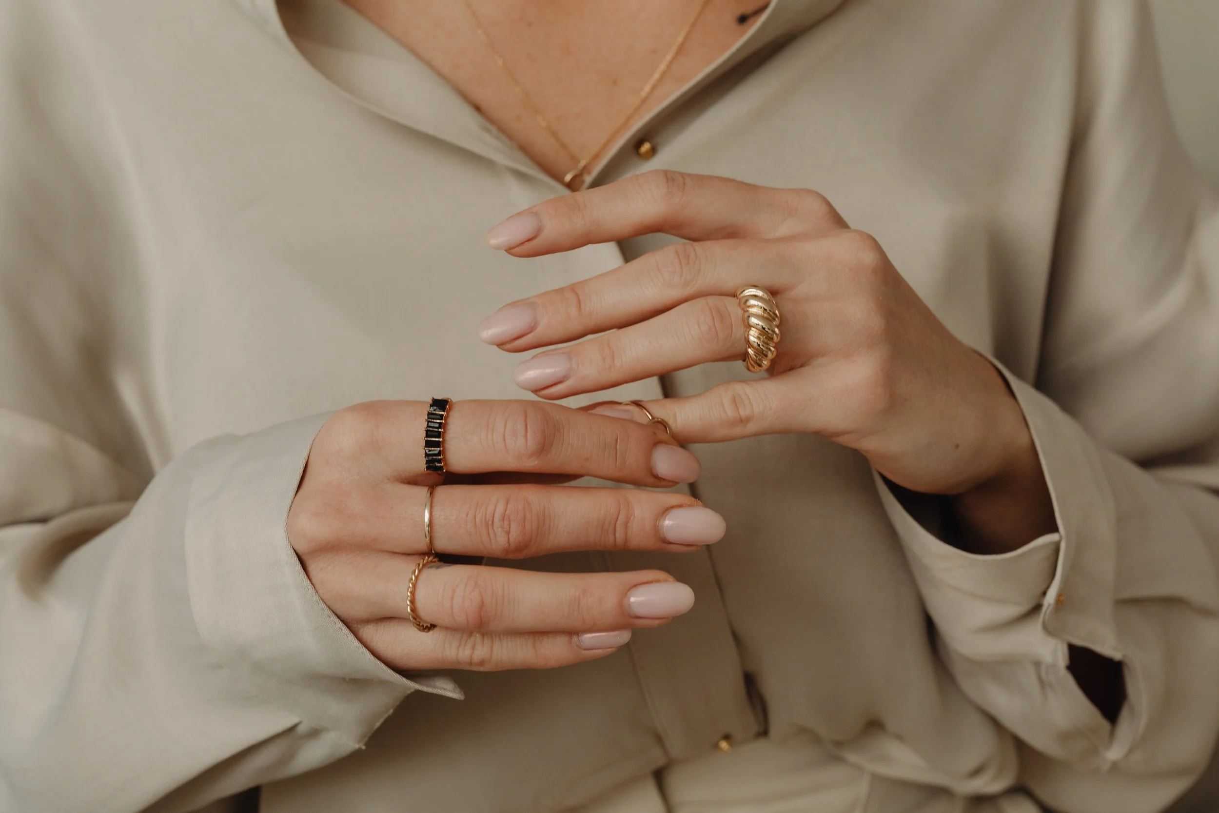 kaboompics_details-of-gold-jewelry-beautiful-woman-wearing-a-tan-silk-shirt-28062.jpg