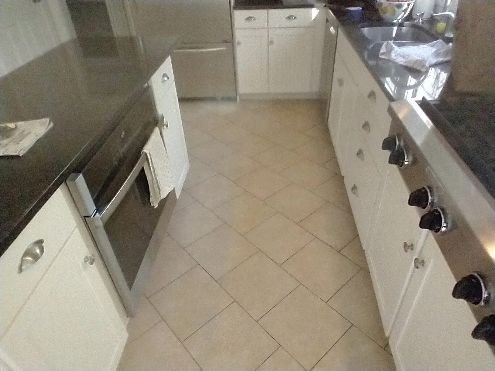 No longer feeling the tile in the kitchen? That's ok. We can update the look with hardwood floor installation.