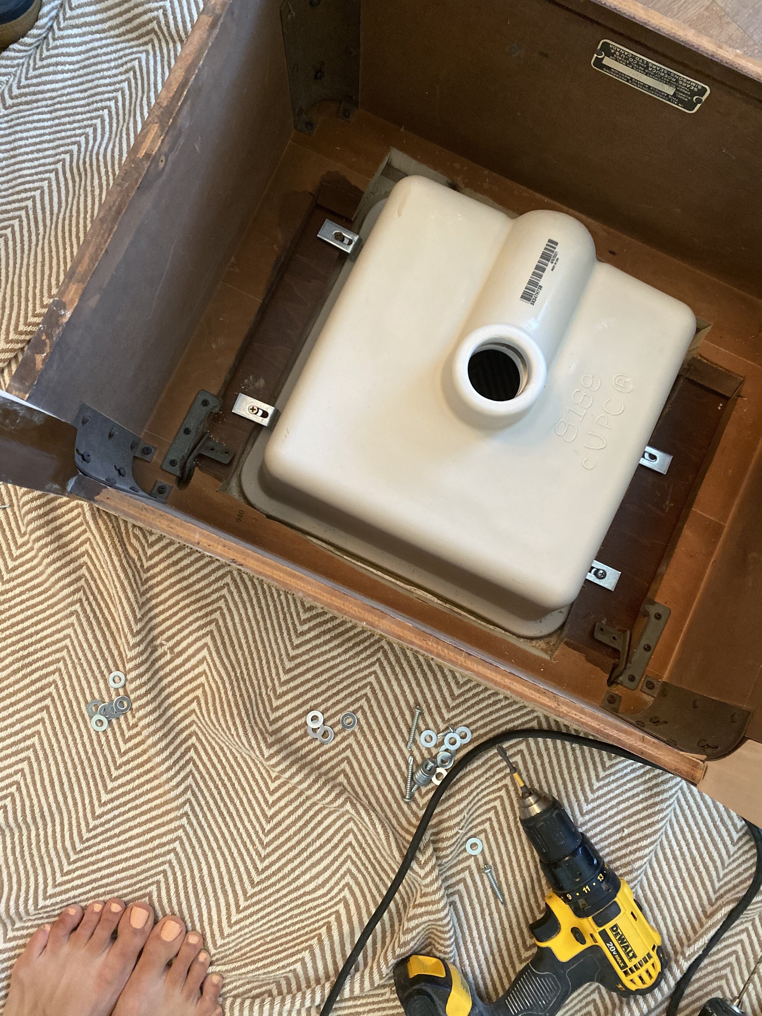 For my repurposed vanity, I installed an under mount sink. It required some trimming with my jigsaw but nothing too in depth. I used birch plywood for the vanity top and coated it with waterproof clear matte poly.