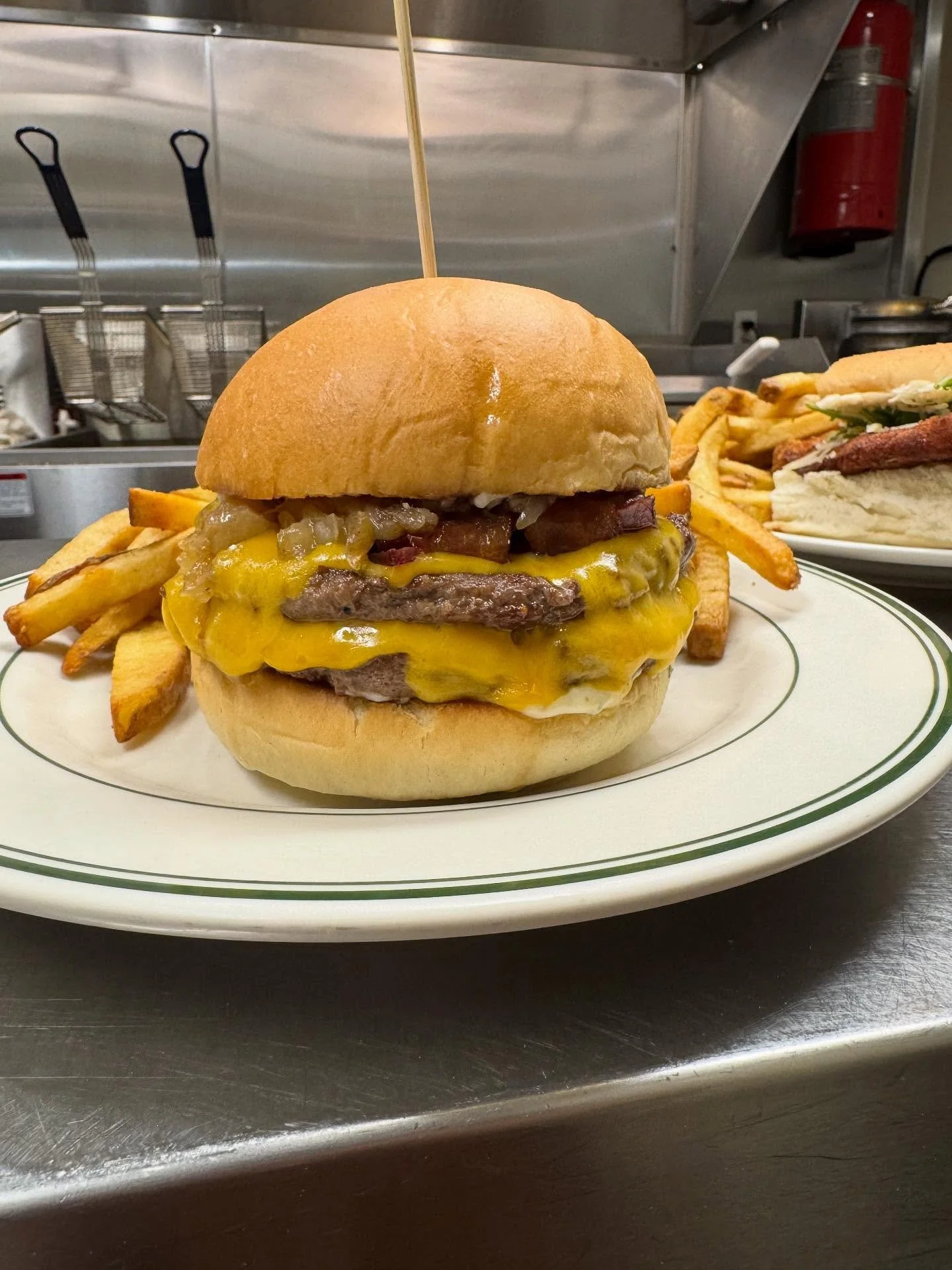 &ldquo;It&rsquo;s lunch time and we&rsquo;re stacking burgers double with that cheddar drip 🍔🧀 Brunch really does give you the best of both worlds 🥂🍳 See you guys tomorrow!&rdquo;