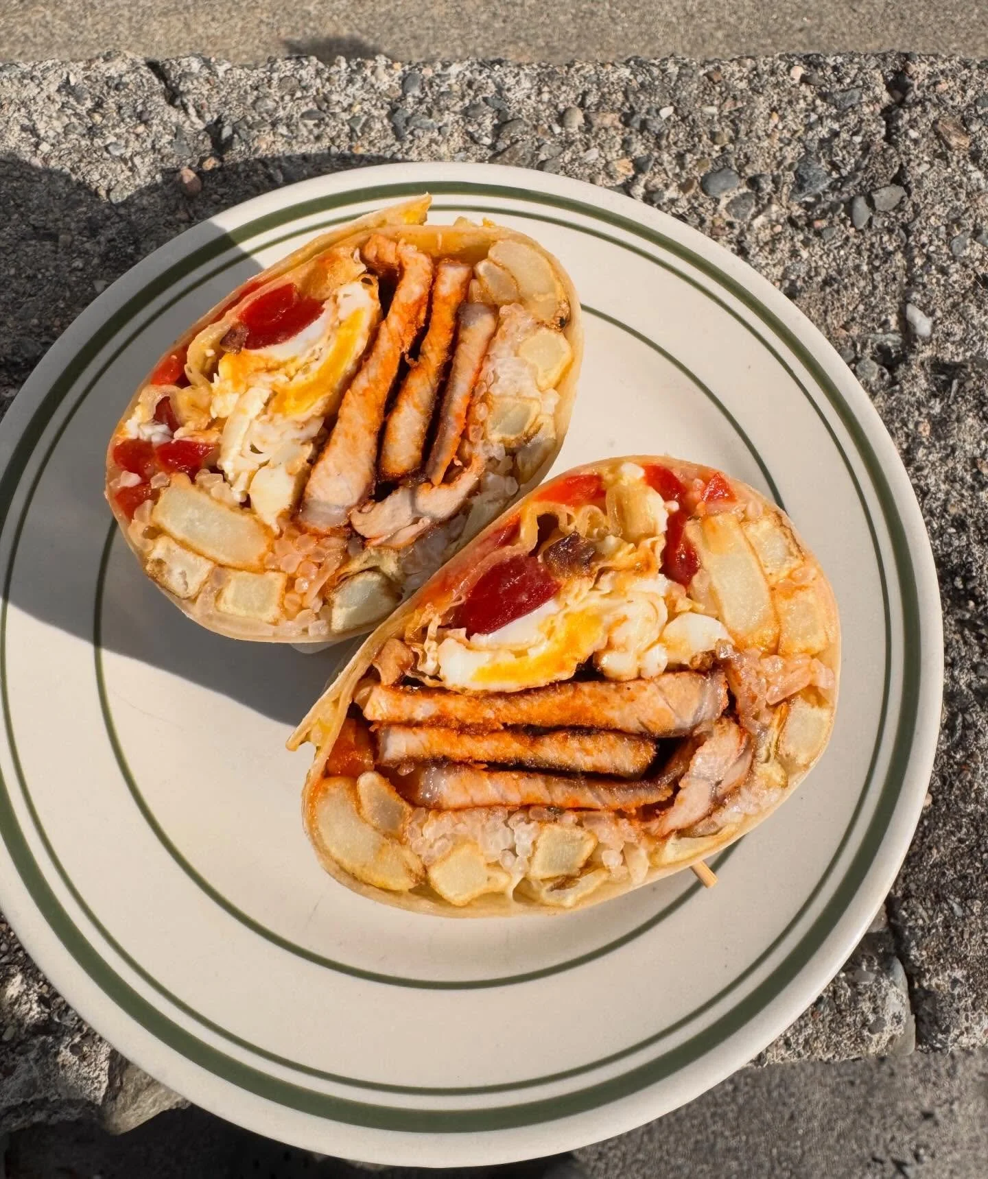 She may not photograph well, but the Bifana burrito is the perfect &ldquo;bring-it-to-Colt-State-Park-because-it&rsquo;s-so-nice-out&rdquo; meal 

Grilled marinated pork, rice, French fries, 2 eggs, garlic aioli, and Portuguese pickled peppers all wr