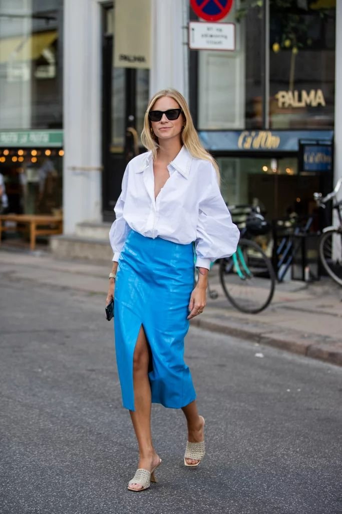 A crisp white puff-sleeve shirt works great with a solid-coloured midi skirt.jpeg