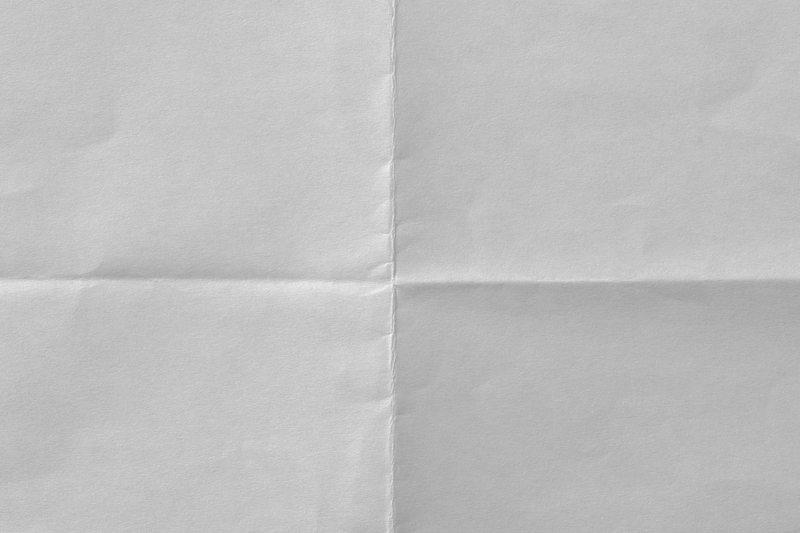 Four pieces of folded black and gray paper arranged in a 2x2 grid.