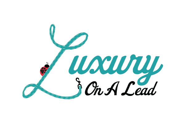 Luxury On A Lead logo with the word 'Luxury' in teal script, a red paw print, and the words 'On A Lead' in black, italic script.
