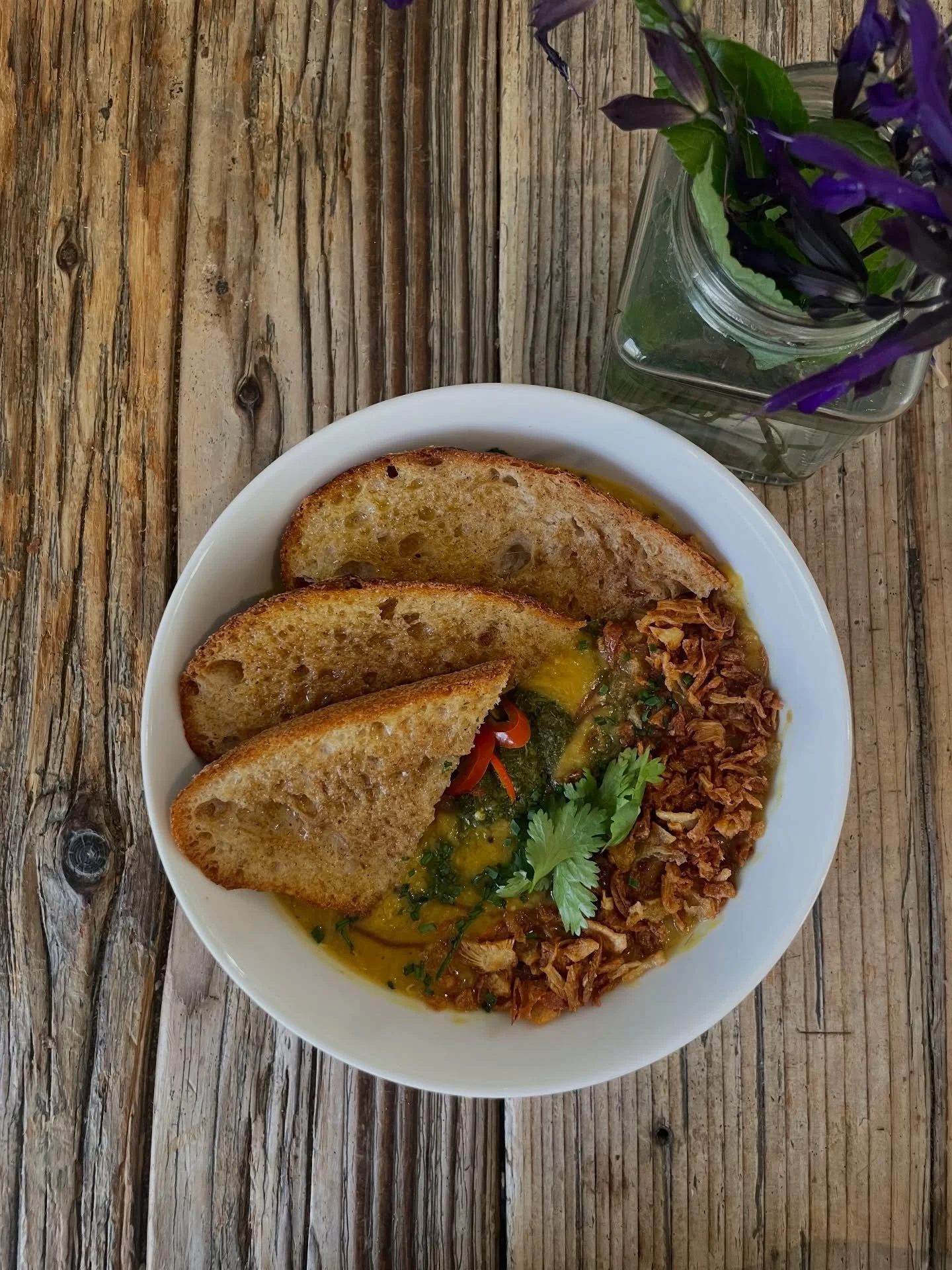One of our faves: coconut daal, coriander chutney, tamarind, pickled chilli with spiced butter sourdough - you can add an egg 🍳 

#lunch #meal #homemade #vegetarian #vegan
