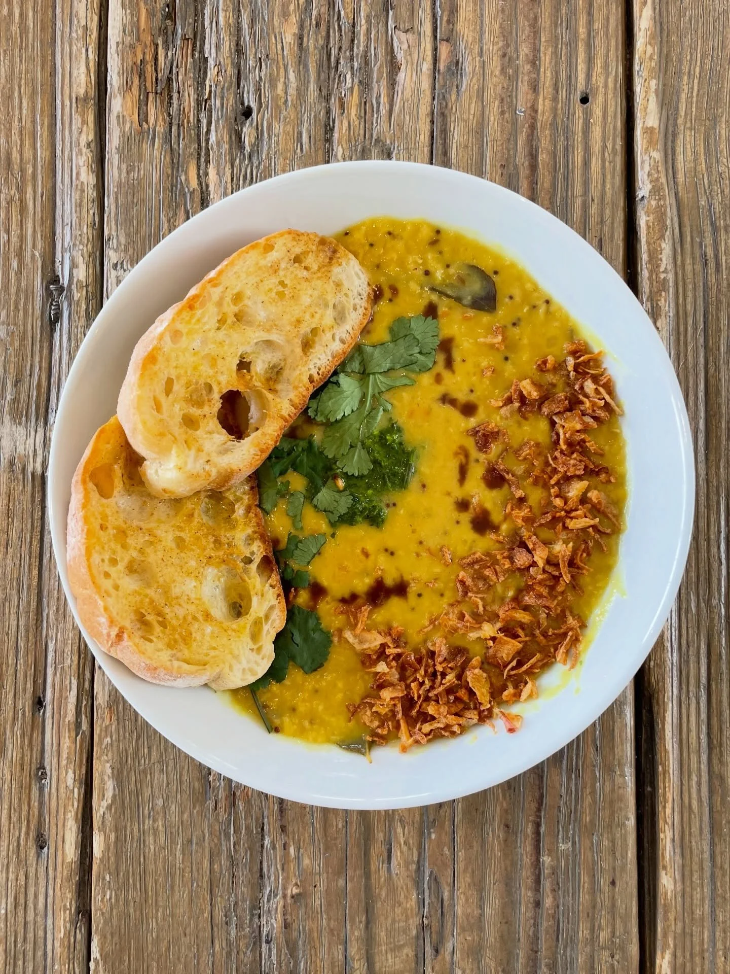 On the menu: dal with coriander chutney, tamarind sauce and spiced butter sourdough toast 🍴 

#lunch #cafe #meal #brixton #loughboroughjunction
