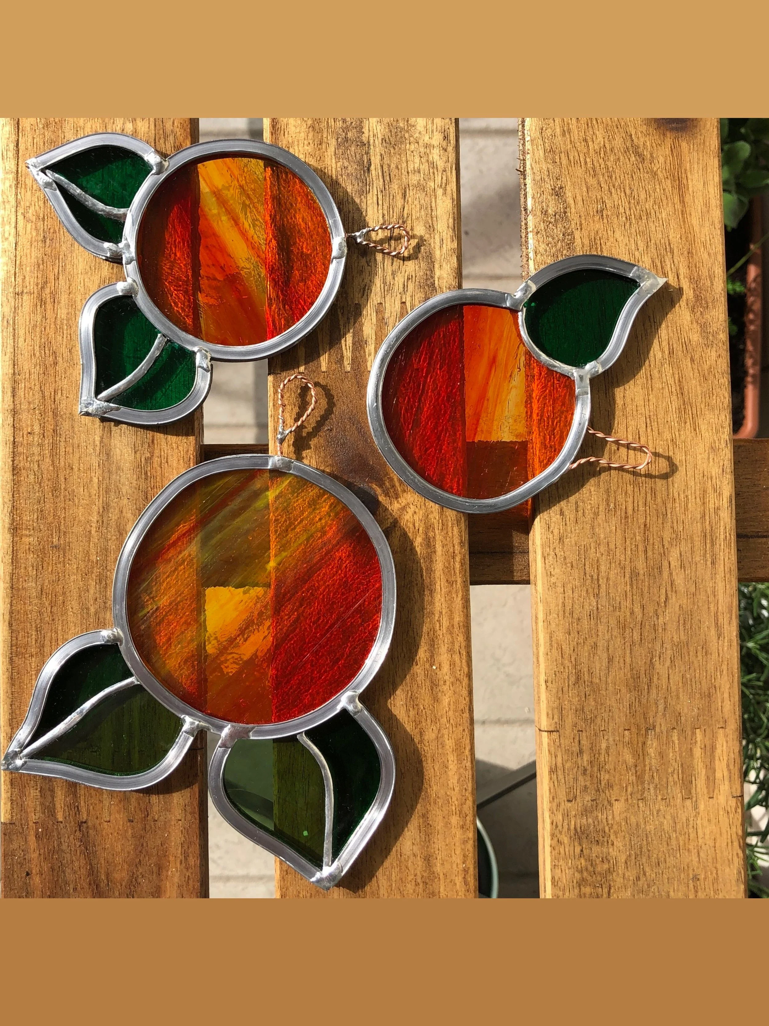 Little stained glass oranges 🍊✨

I loved making these small orange roundels &mdash; bright, cheerful pieces to hang in a window or on a wall.

They were made by hand using coloured glass, lead and copper foil, combining the traditional leaded staine