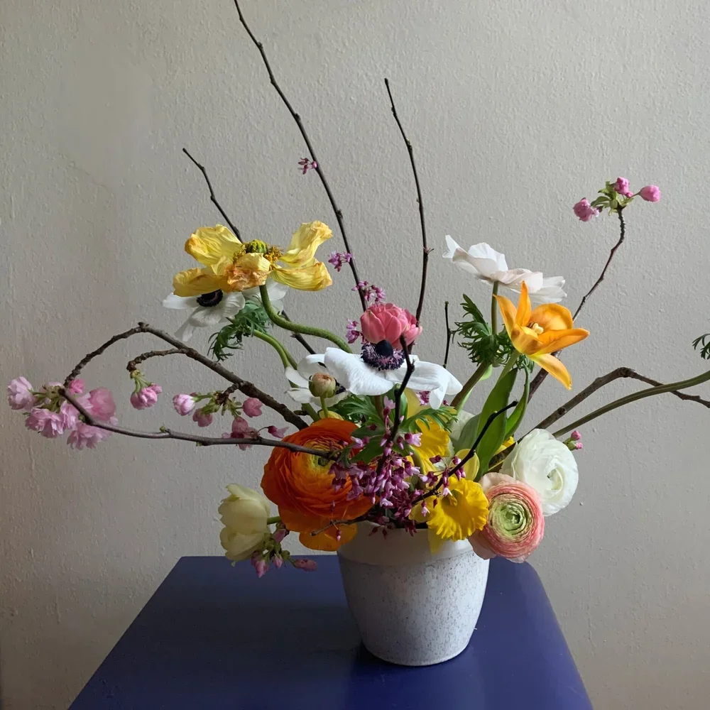 vase-on-blue-table-floral-design-nyc-valentina-spalten.webp
