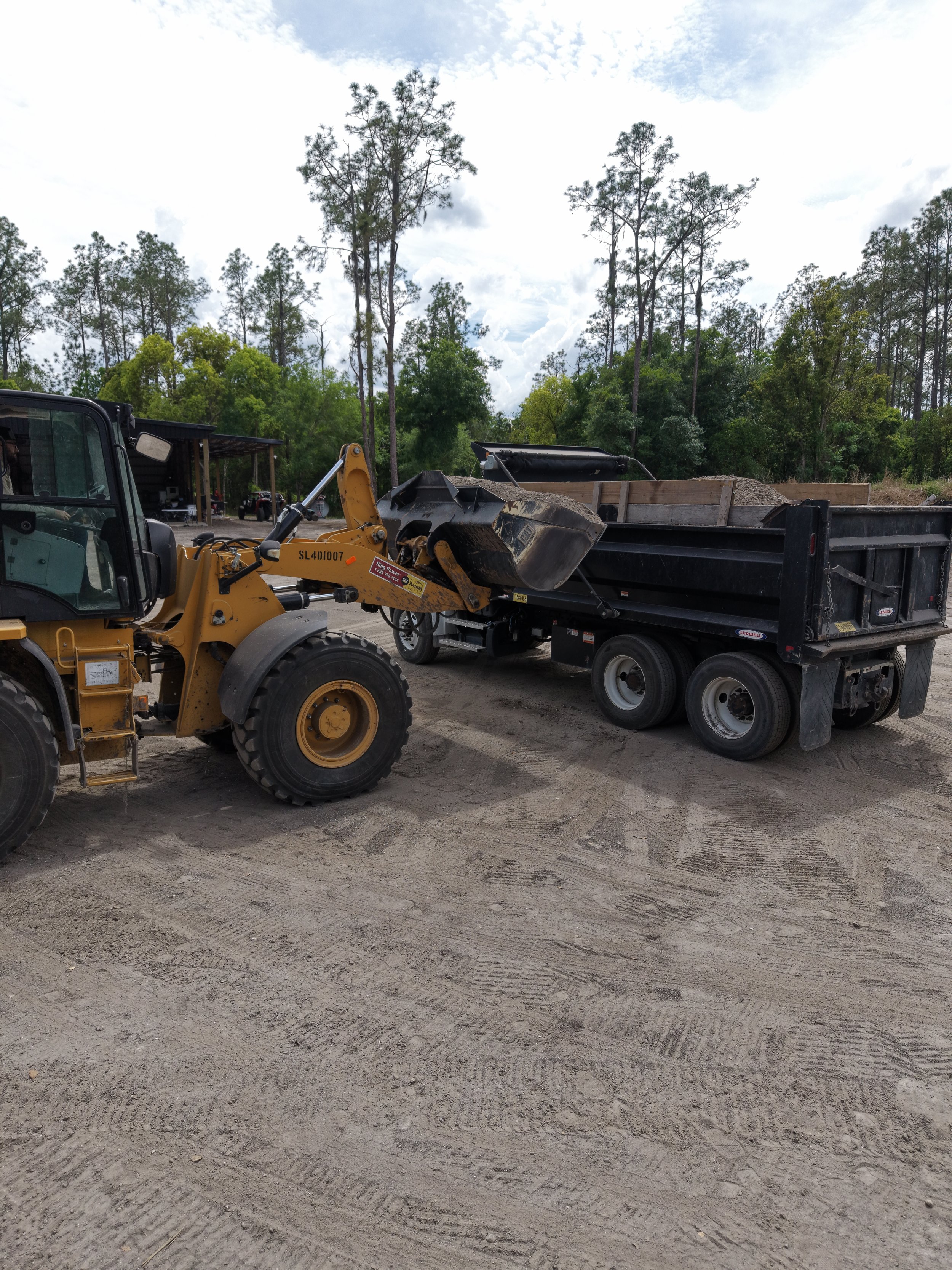 Loading dump truck for material delivery