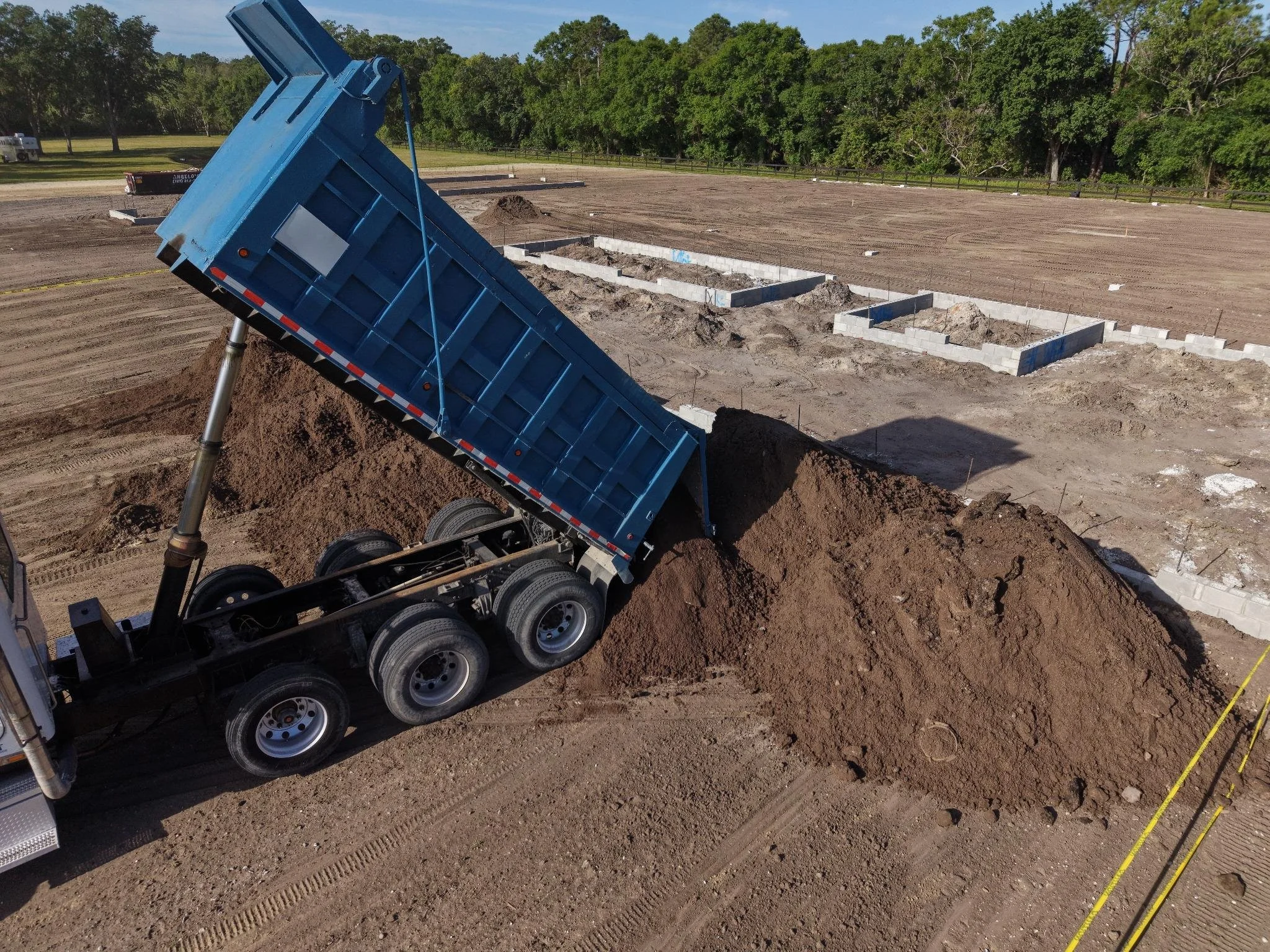 Dump Truck delivering fill dirt