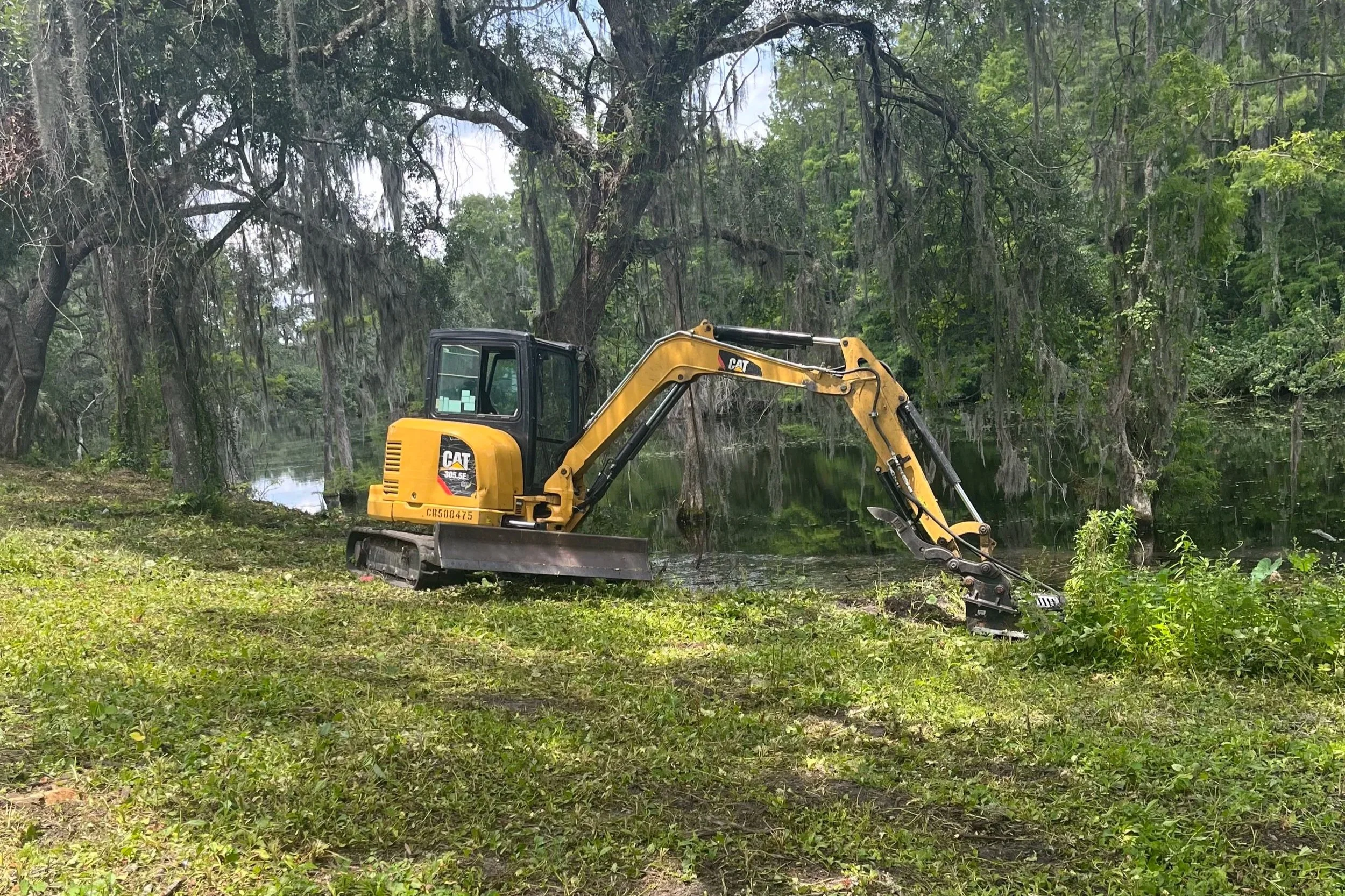 Erosion control and drainage solution with a CAT 309 Excavator in Lake