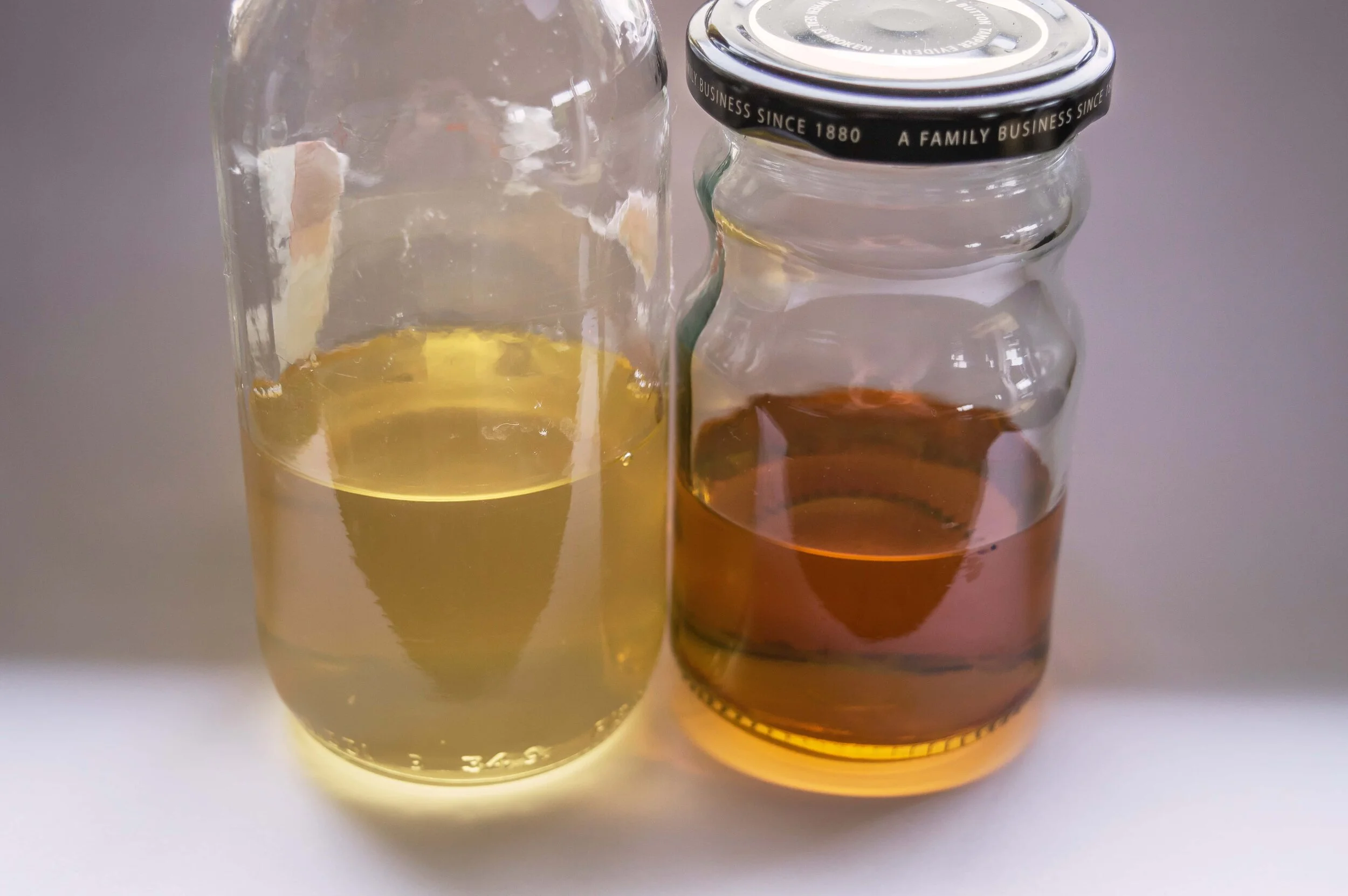 The jar on the left contains ‘clear’ lacquer and the jar on the right contains the same clear lacquer after a week in the sun.