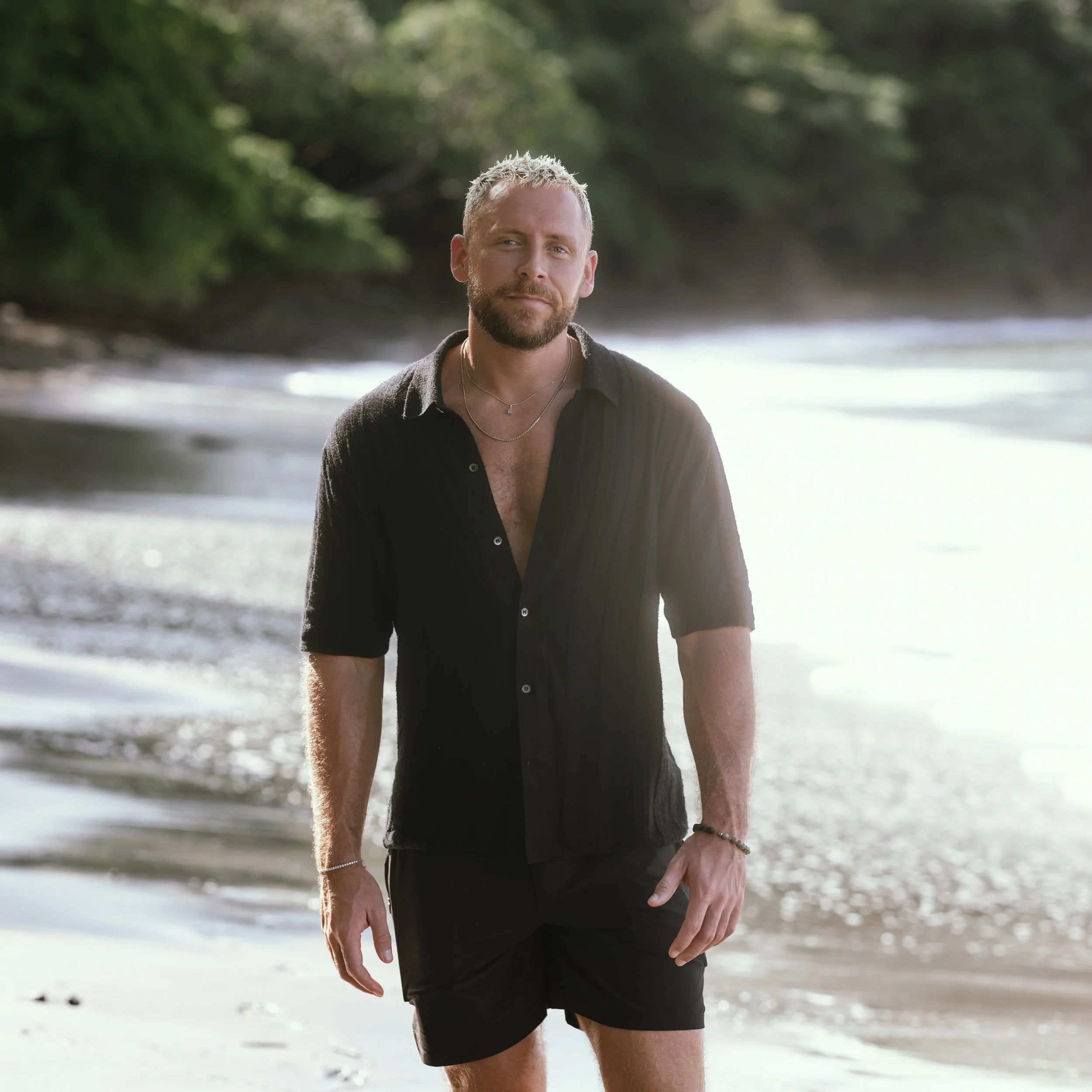Tom Wilson-Leonard standing beside the sea