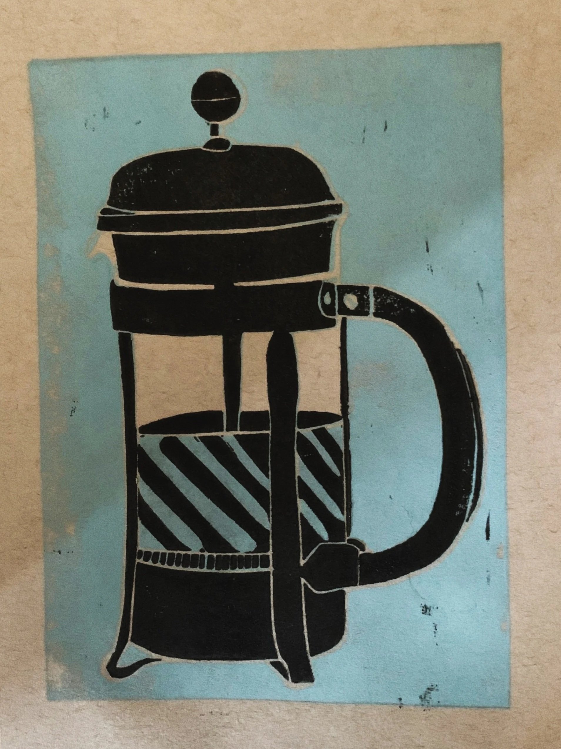 Stencil art of a coffee percolator on a blue background.
