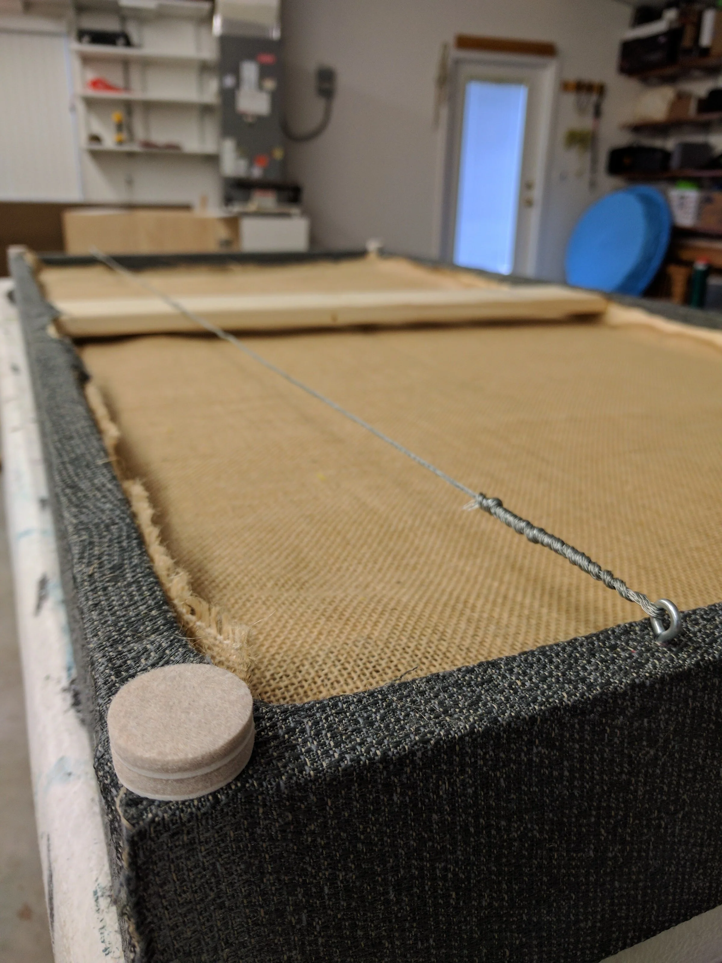 These feet were added to the corners to prevent the frames from sitting against the walls, which could lead to extra vibrations and possibly more noise.