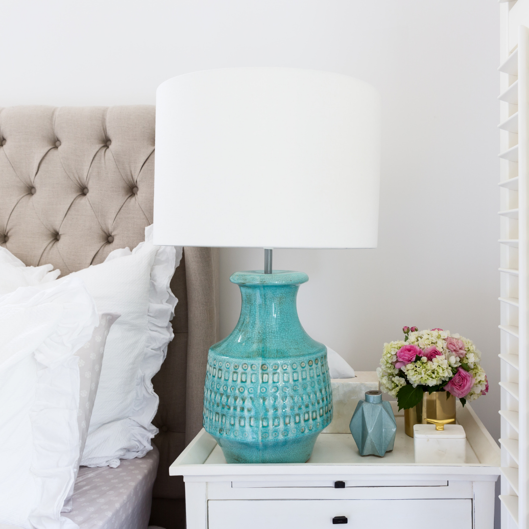 Organised bedroom with styled bedside table and fresh flowers by O2B Organised