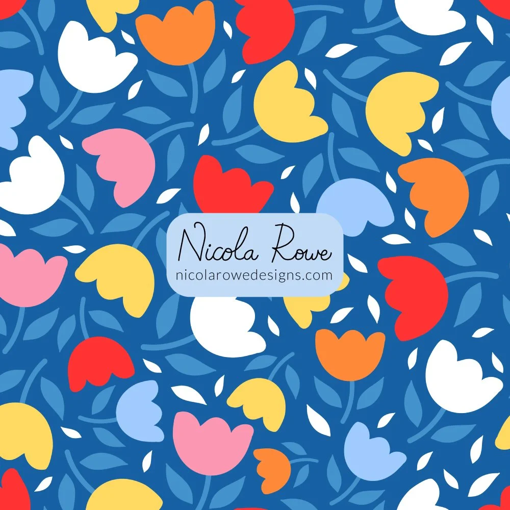 bright yellow, red, orange, pink, light blue and white tulip flowers pattern design on a blue background