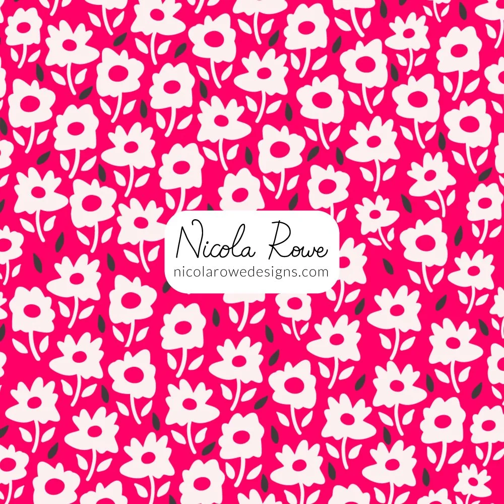 white irregular flowers pattern design on a bright pink magenta background with black leaves.