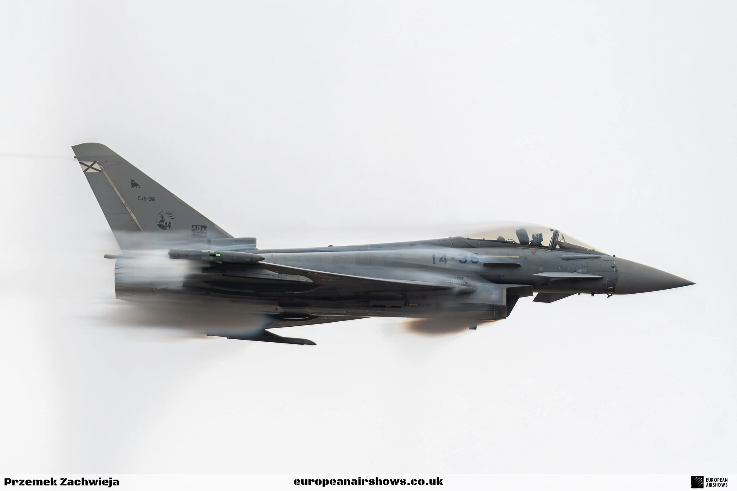 A military jet airplane flying in the sky.