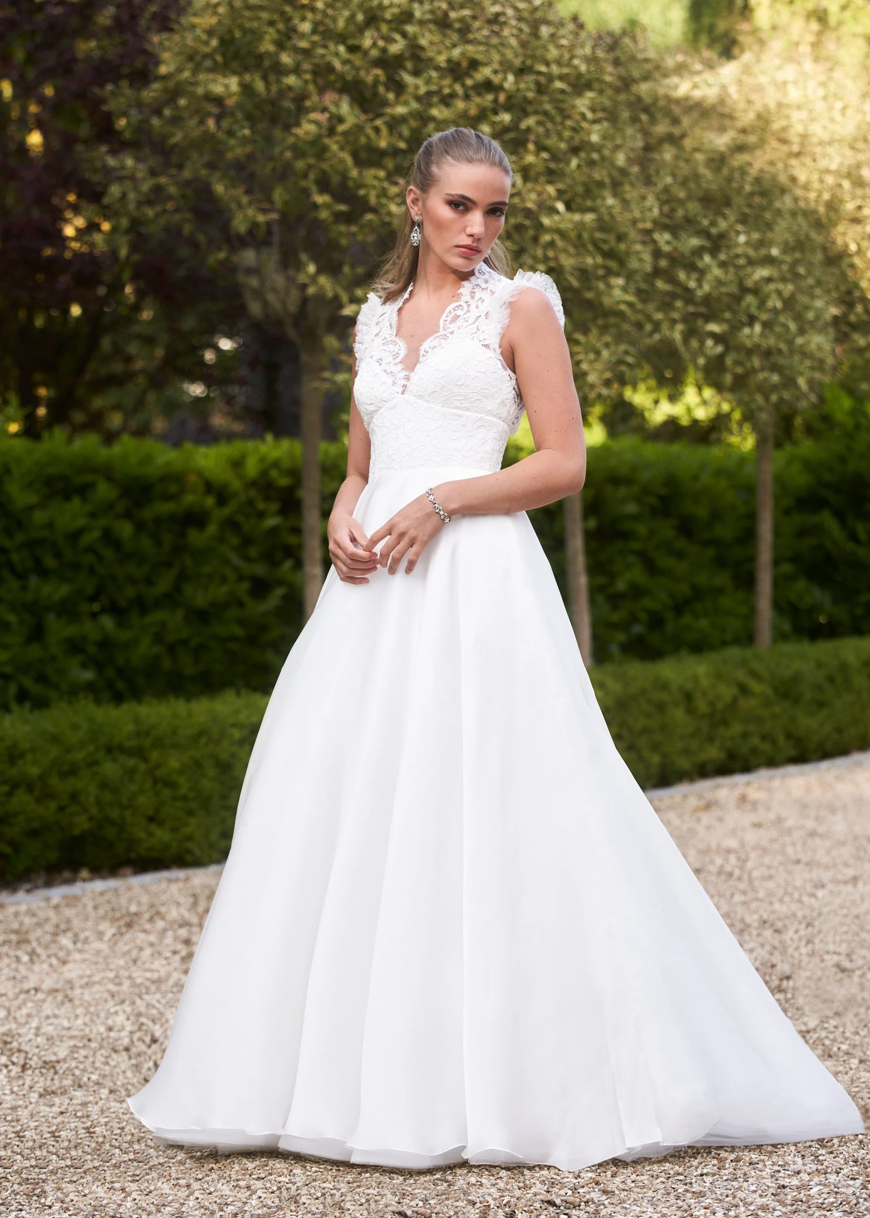 Traditional wedding dress with lace bodice, gathered shoulder ruffle and silk organza a-line skirt