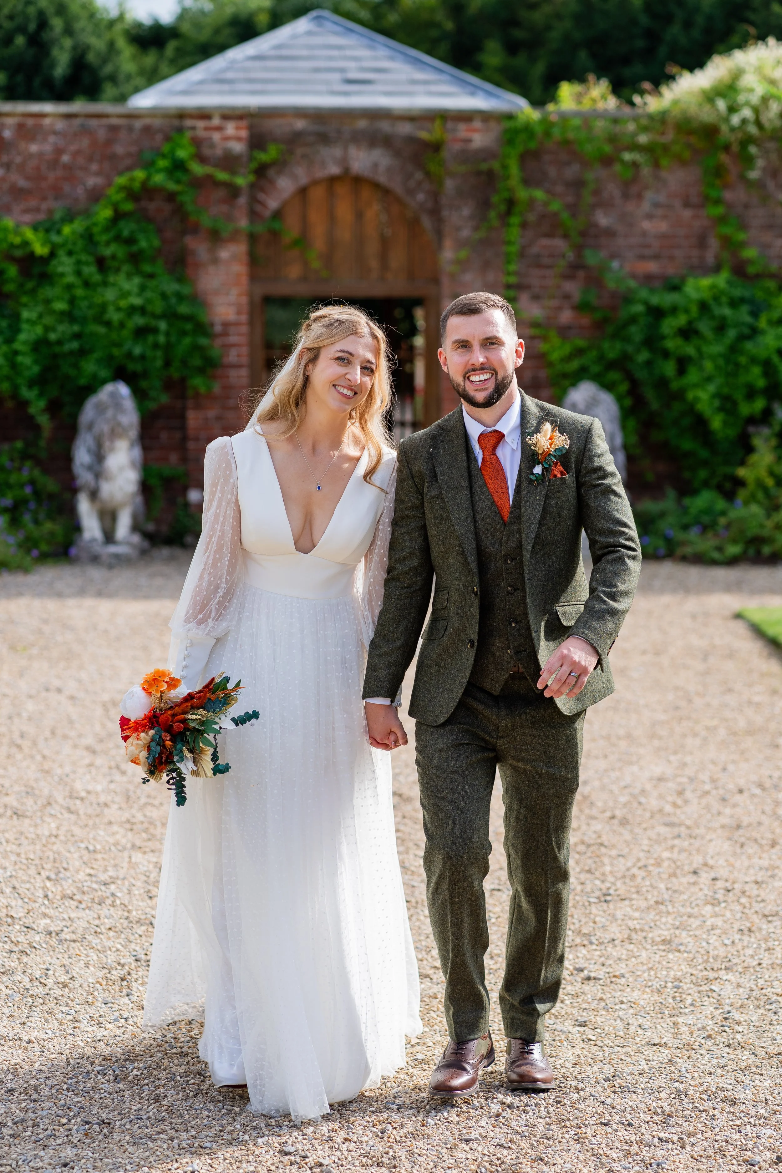 Bride and groom.  Bride wears Sassi Holford from Boo Bridal