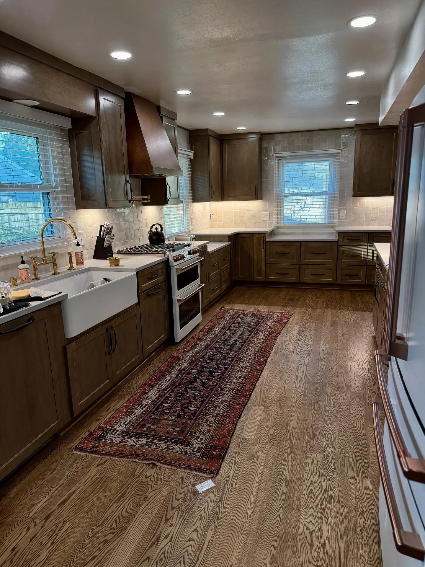 Transformative, bespoke interiors are my calling card. Anything cookie cutter or basic hurts my heart! 

This kitchen has come a long way baby.

A sneak peek photo: Custom cabinetry, new hardwood floors (real hardwood only), soapstone countertops, ha