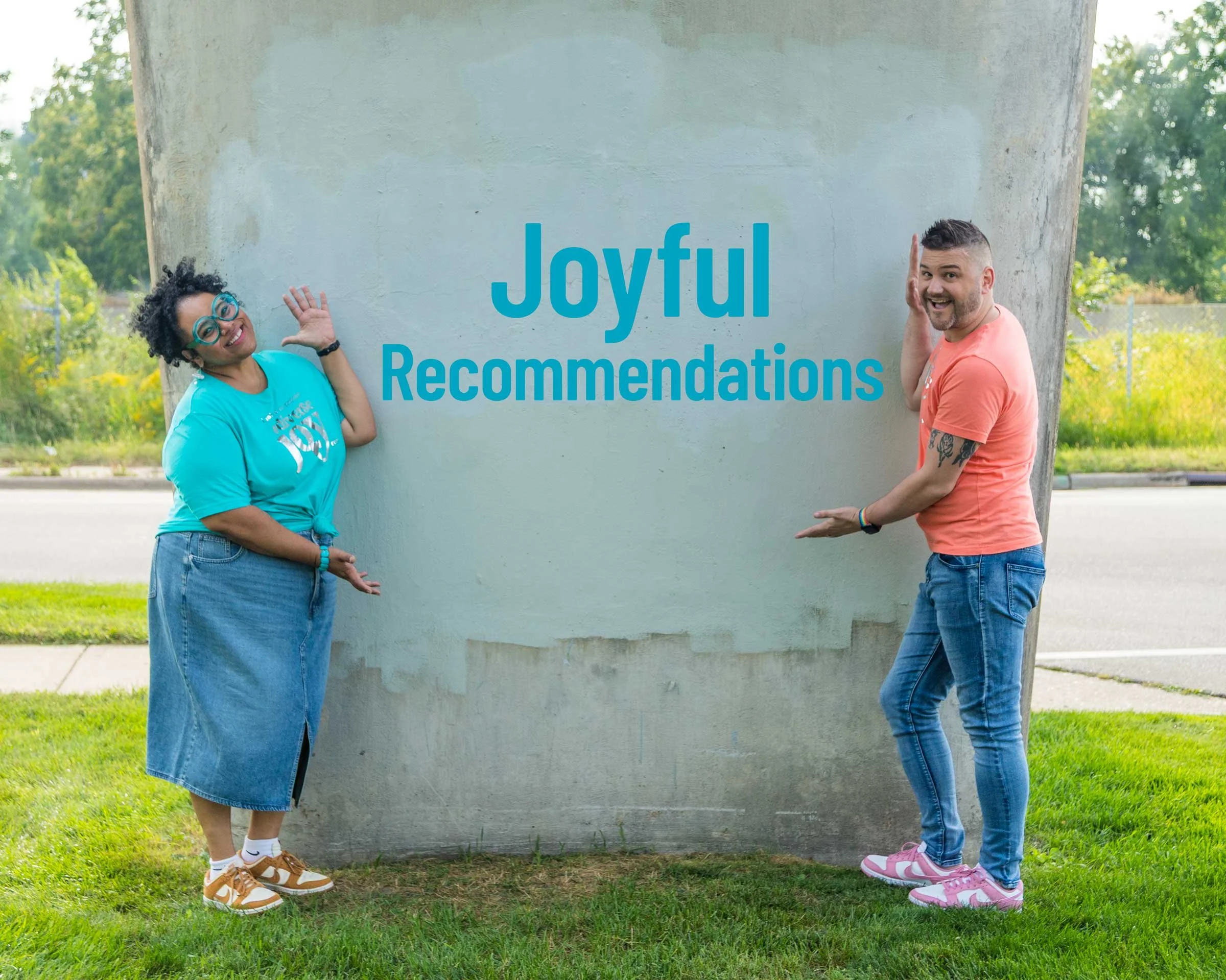 Dr Nelson and Dr Cox in casual outfits gesturing towards a blank wall with Joyful Recommendations superimposed on it