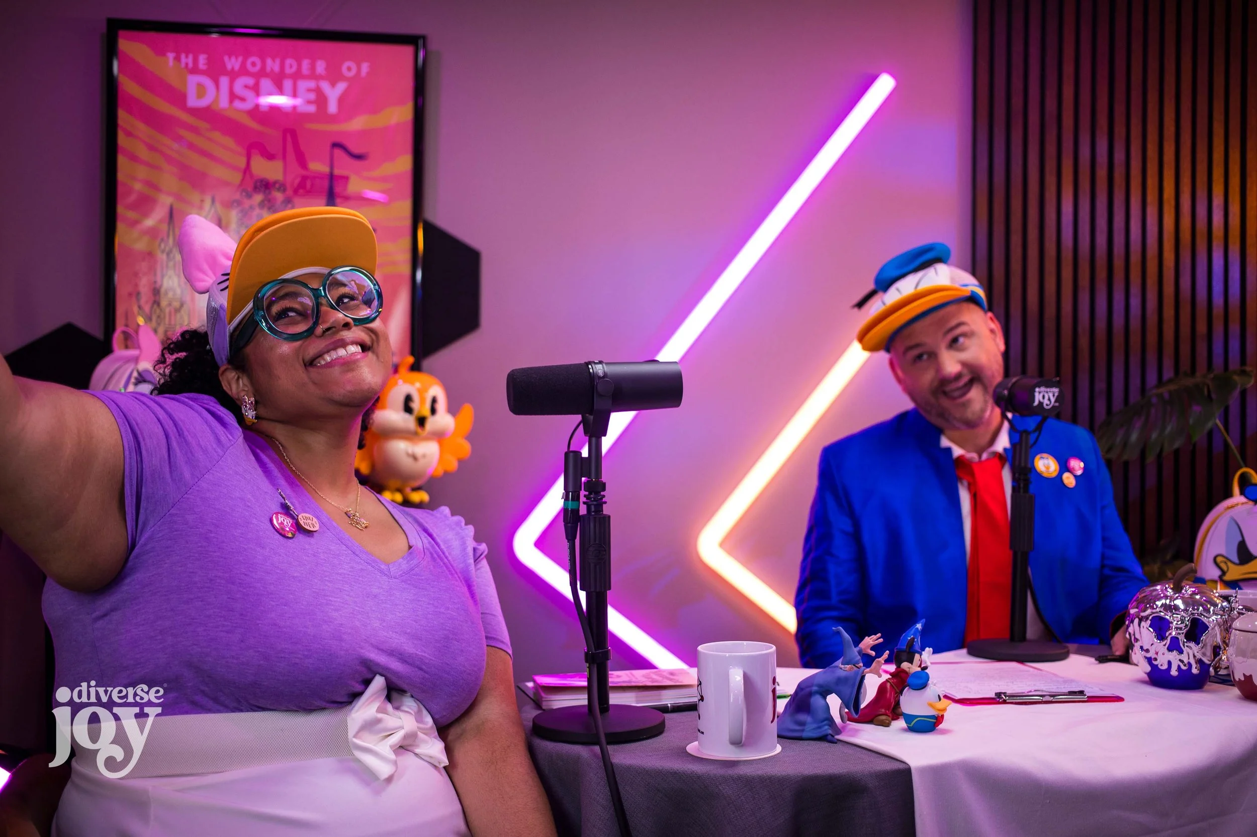 Amber and Will pose for a selfie during the recording session of this episode of Diverse Joy, where they are Disneybounding as Daisy and Donald Duck, the photo itself is not the selfie