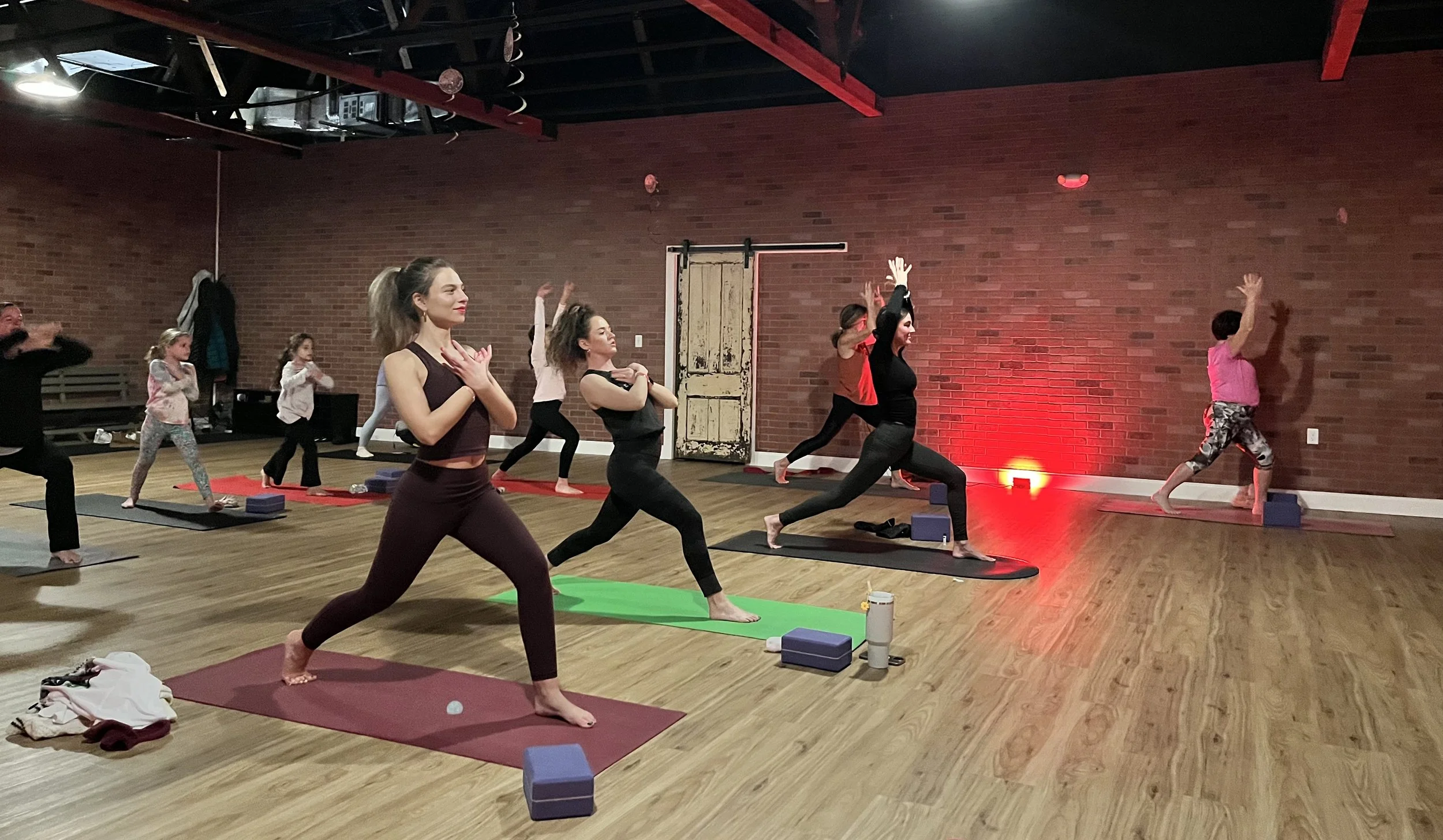 Feeling fearless! 💛 Our Taylor Swift yoga students strike the heart mudra inspired by her iconic song.