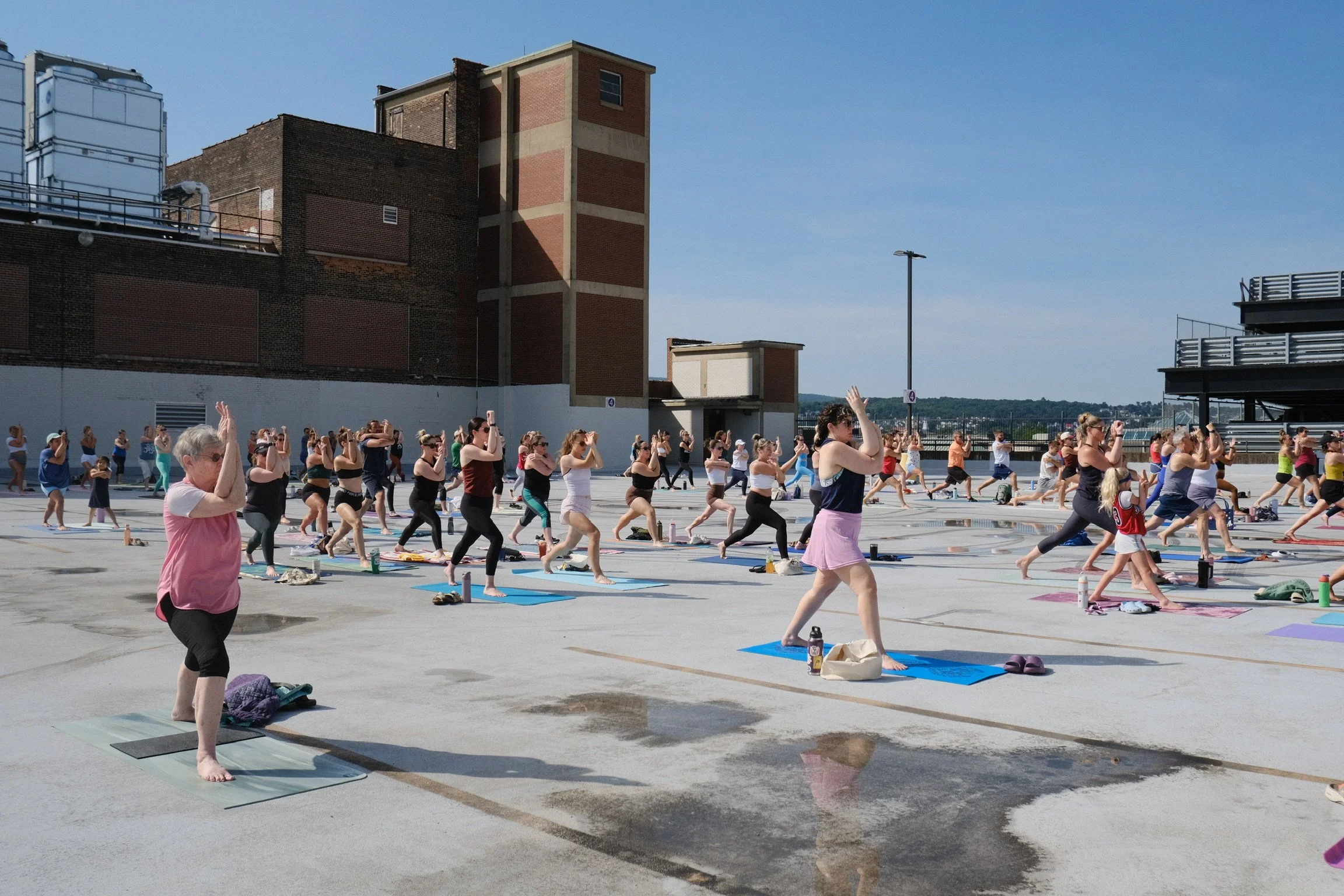 jaya-yoga-studio-participants-warrior-i-eagle-arms-yoga-on-the-roof-scranton-2026.jpg