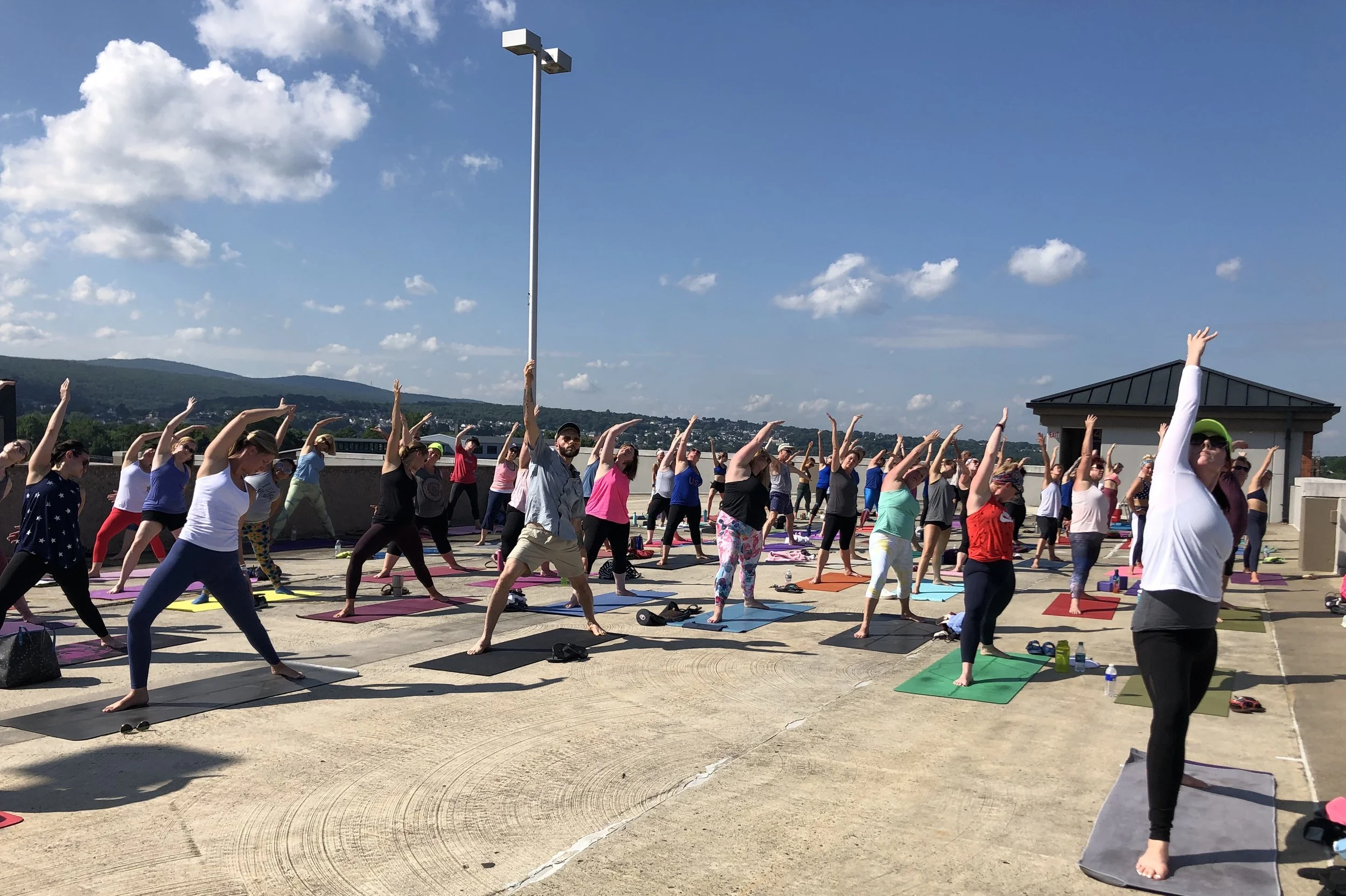peaceful-warrior-reverse-warrior-yoga-on-the-roof-jaya-yoga-studio-scranton-pa.jpg
