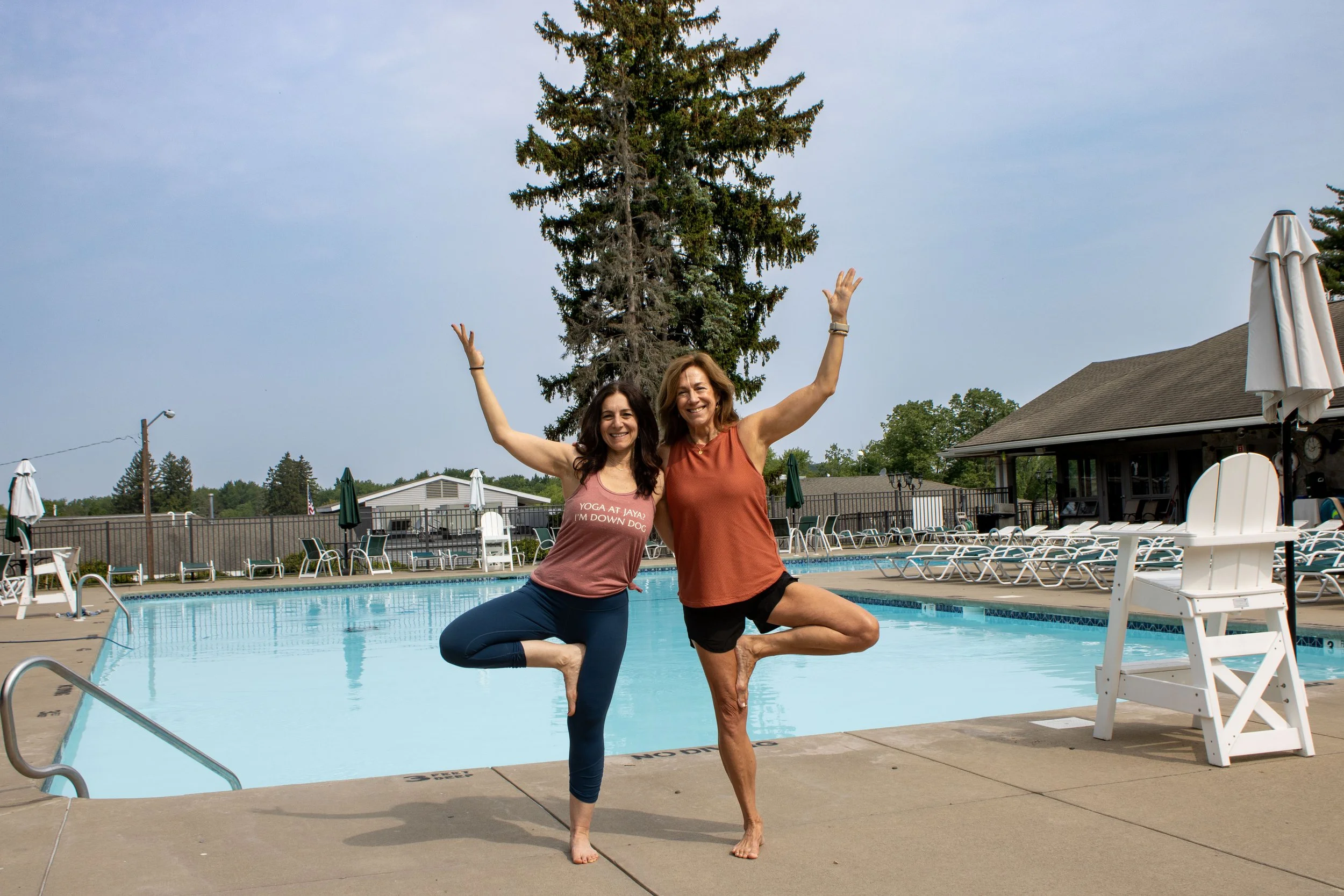Owner of Jaya Yoga, Hilary Steinberg and instructor, Renea Egan, demonstrating Tree Pose during Aqua Yoga at Glen Oak Country Club in Clarks Summit, PA.