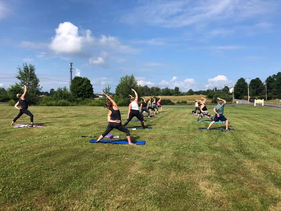 jaya-yoga-group-warrior-poses-outdoor-yoga-camelot-lawn.jpg